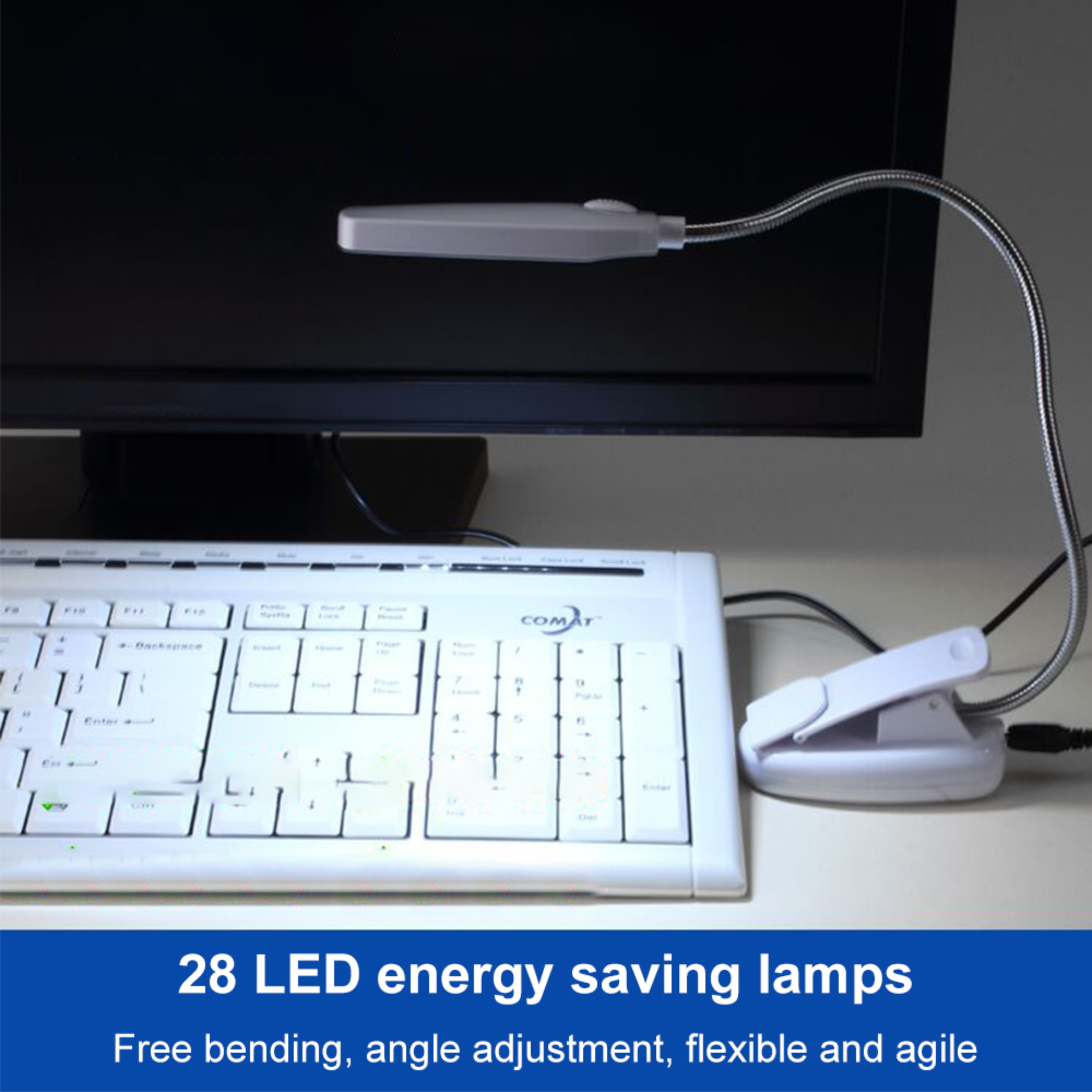 Eine weiße LED-Klemmleuchte ist über einer Tastatur und einem Monitor angebracht.