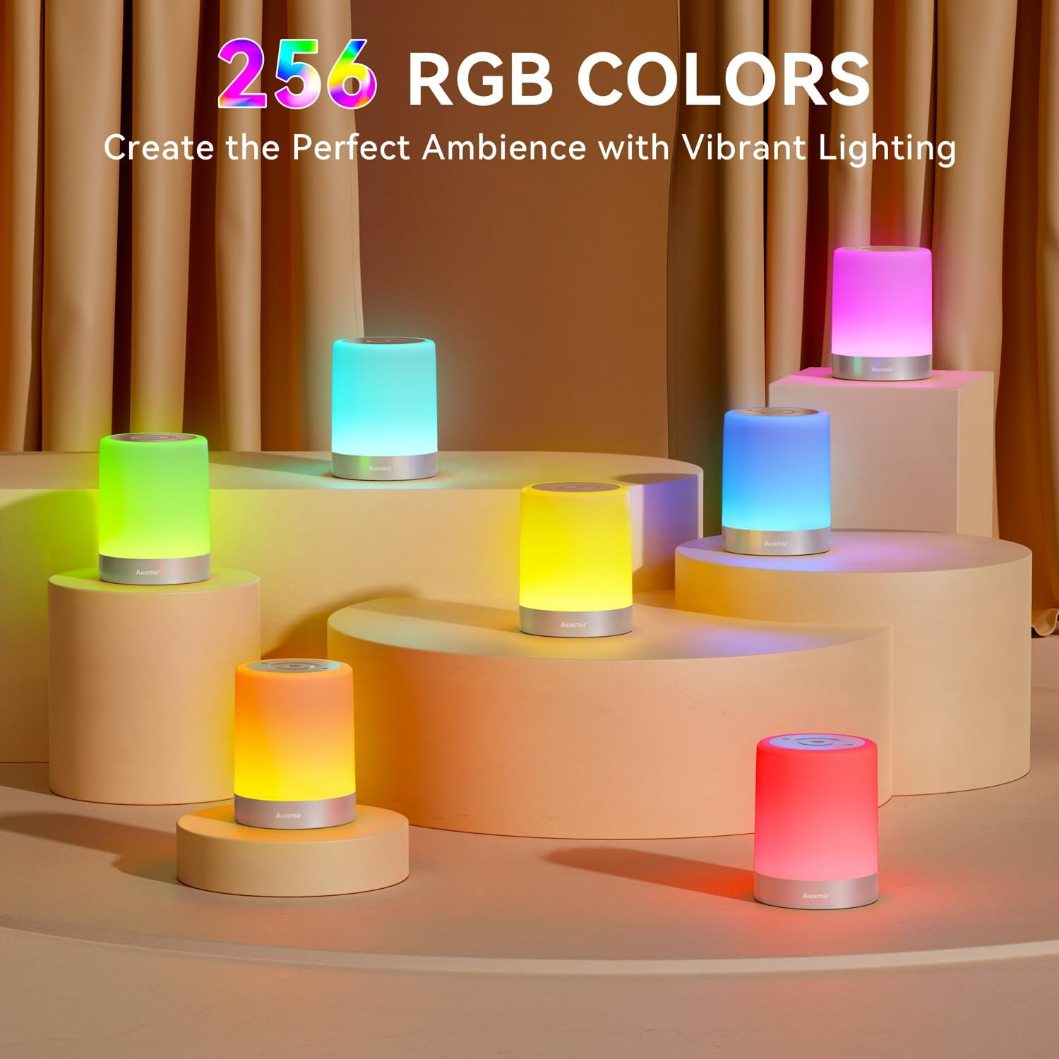 Sechs zylindrische Lampen in verschiedenen RGB-Farben auf einem Sockel.