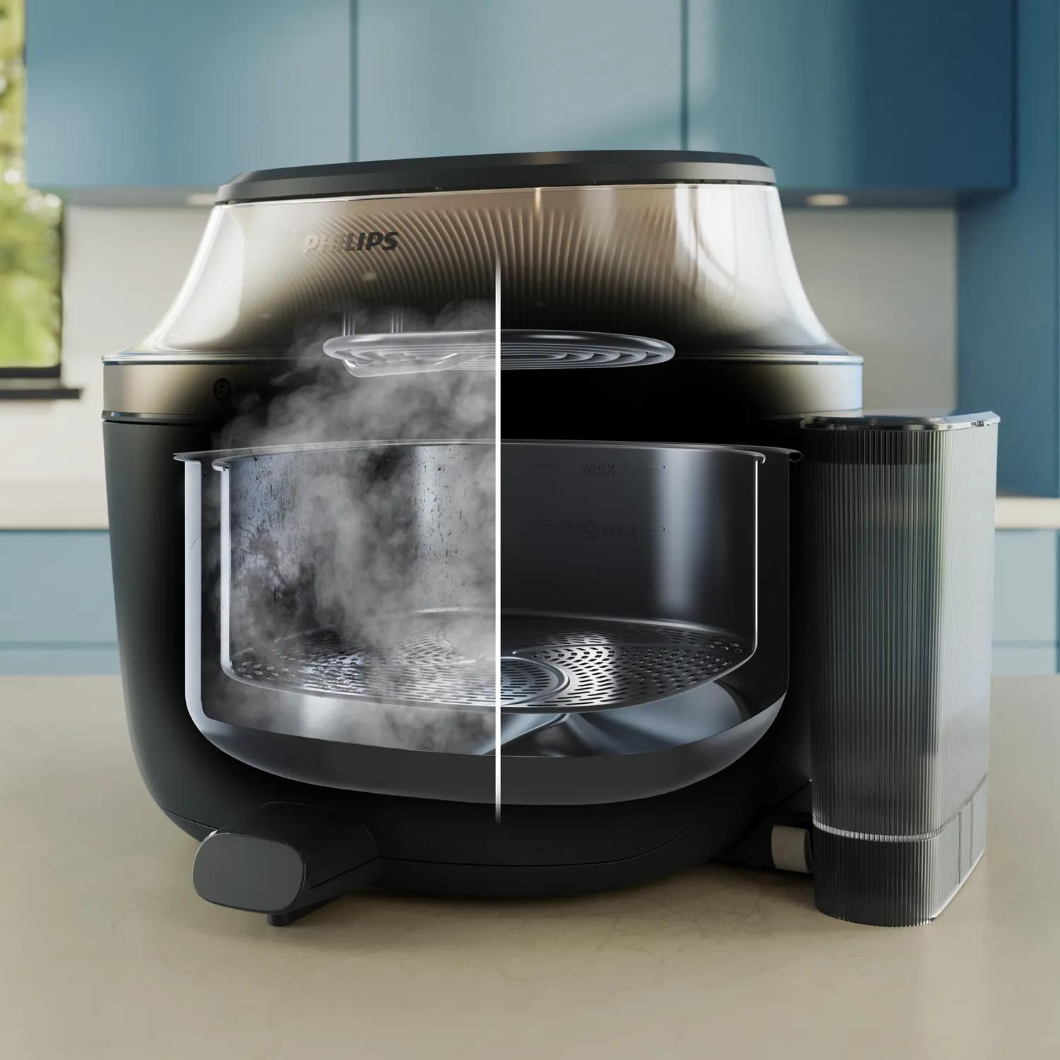 Una vaporiera Philips con ciotola trasparente, fumo che sale.