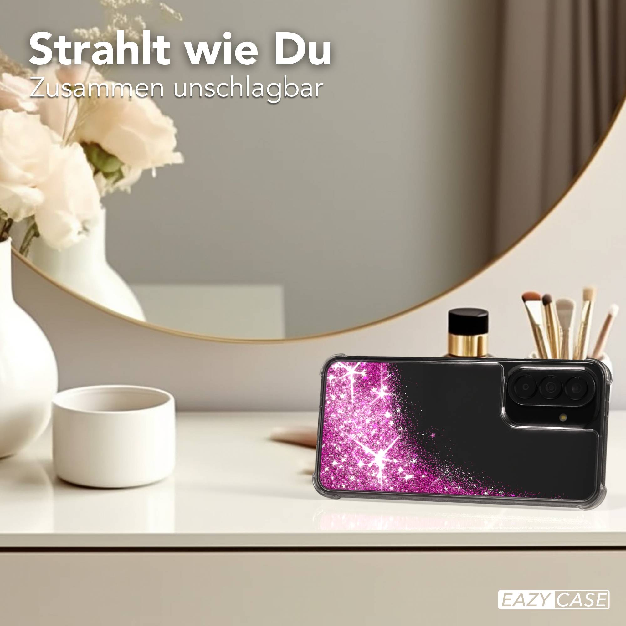 Schwarzes Handyhülle mit pinkem Glitzer-Design, auf einem Tisch.