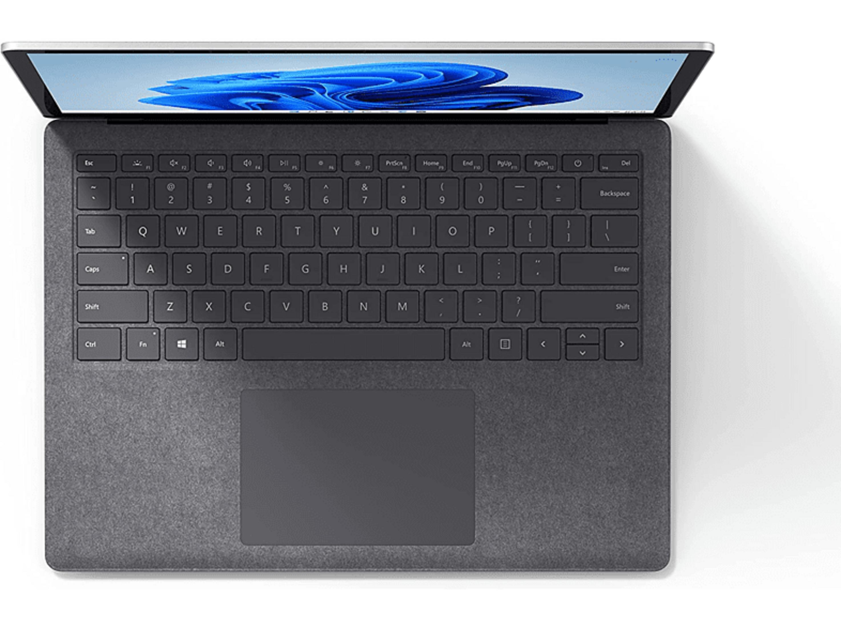 Grauer Laptop mit geöffnetem Bildschirm und Tastatur.