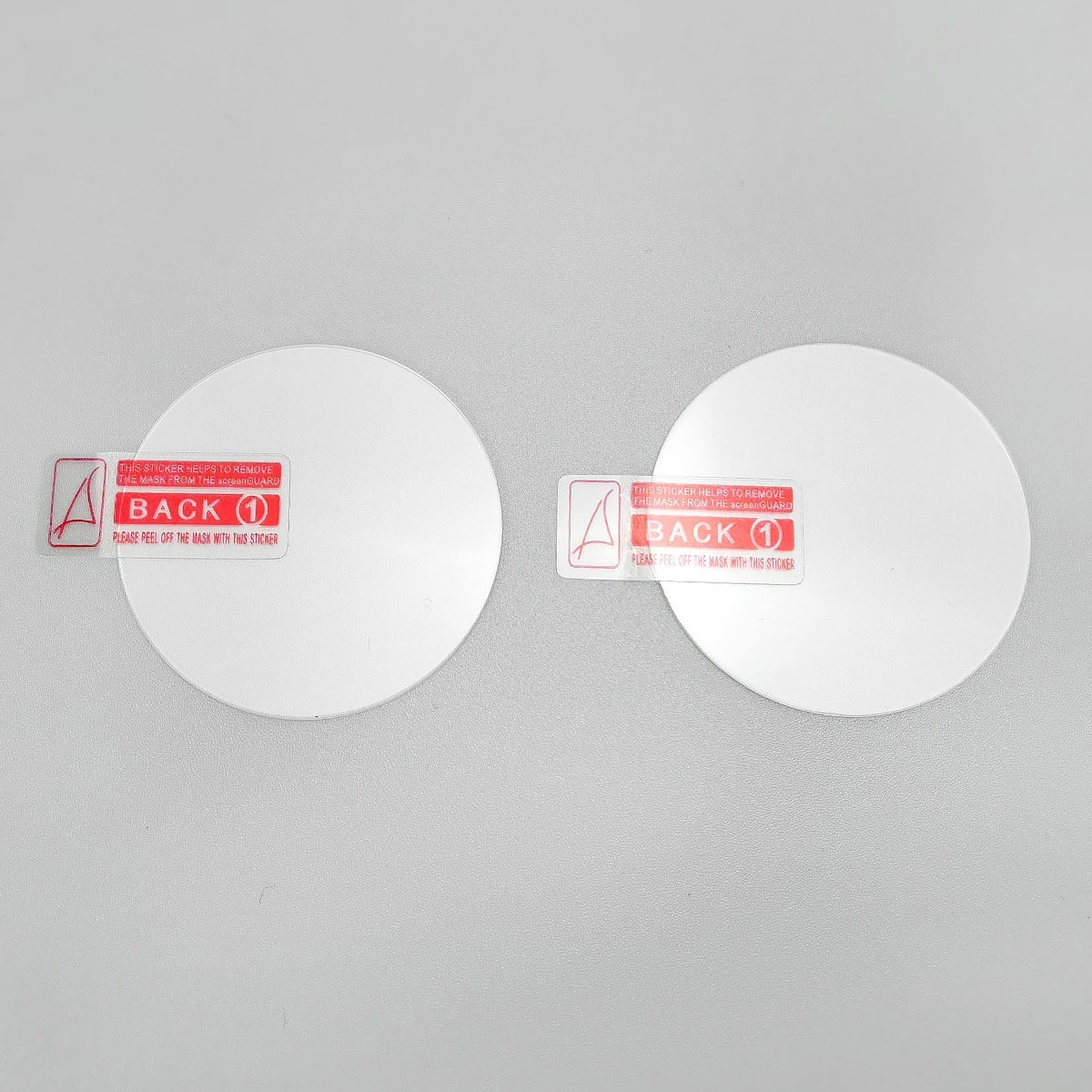 Due protezioni schermo rotonde con adesivi per rimuovere il retro.