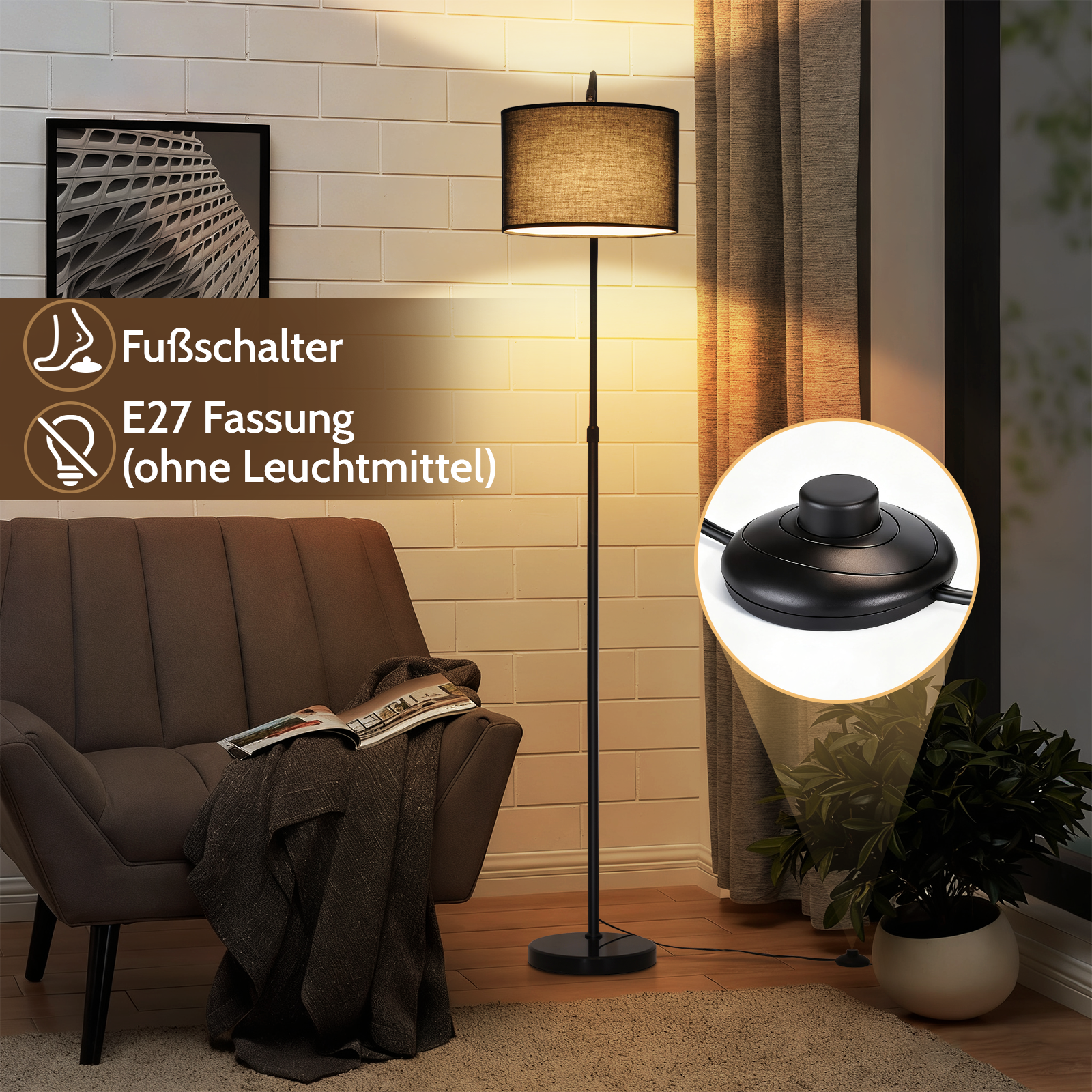 Una lámpara de pie negra con pantalla de tela junto a un sillón con manta.