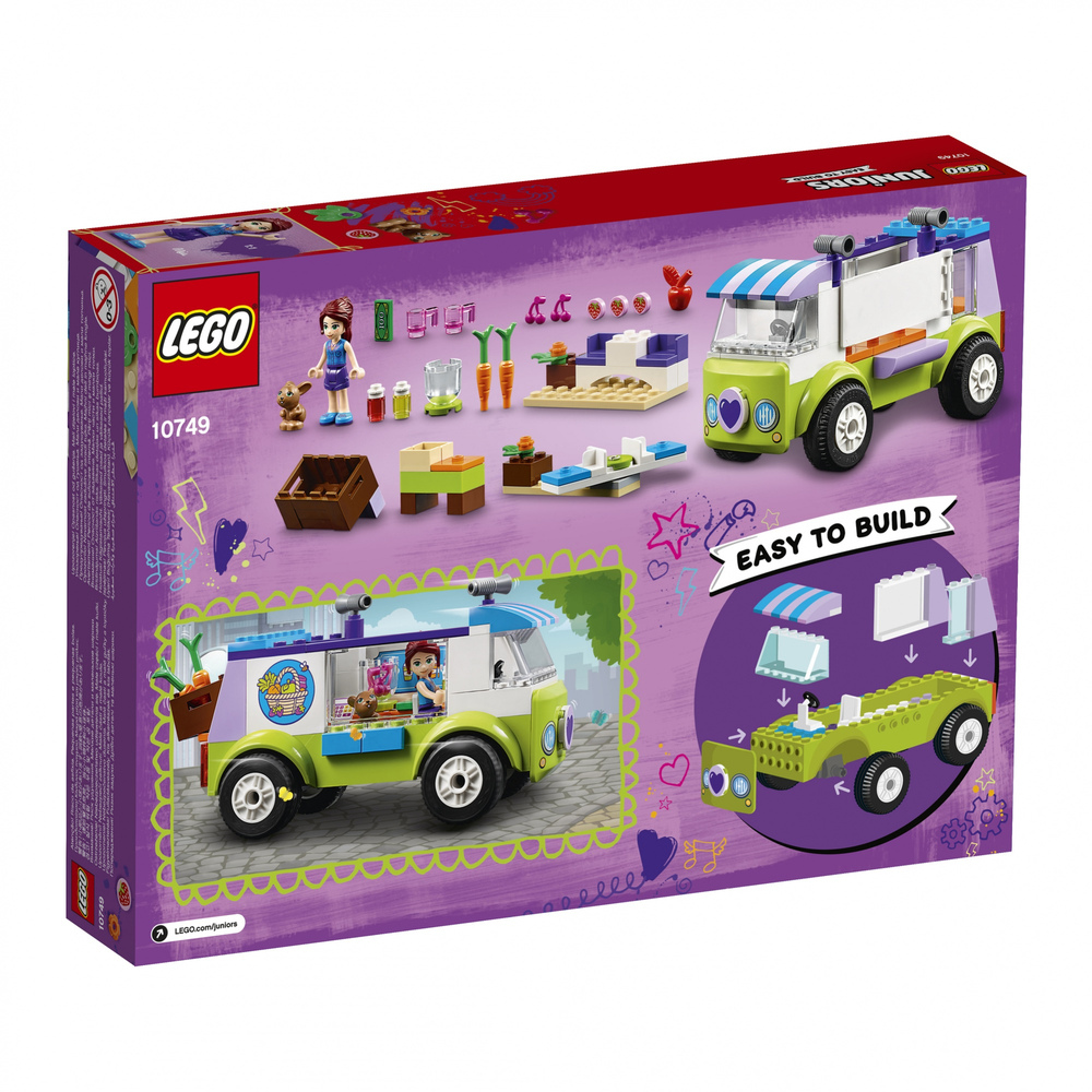 Scatola Lego che mostra giocattolo costruibile, mini figure, un cane e un camion verde.