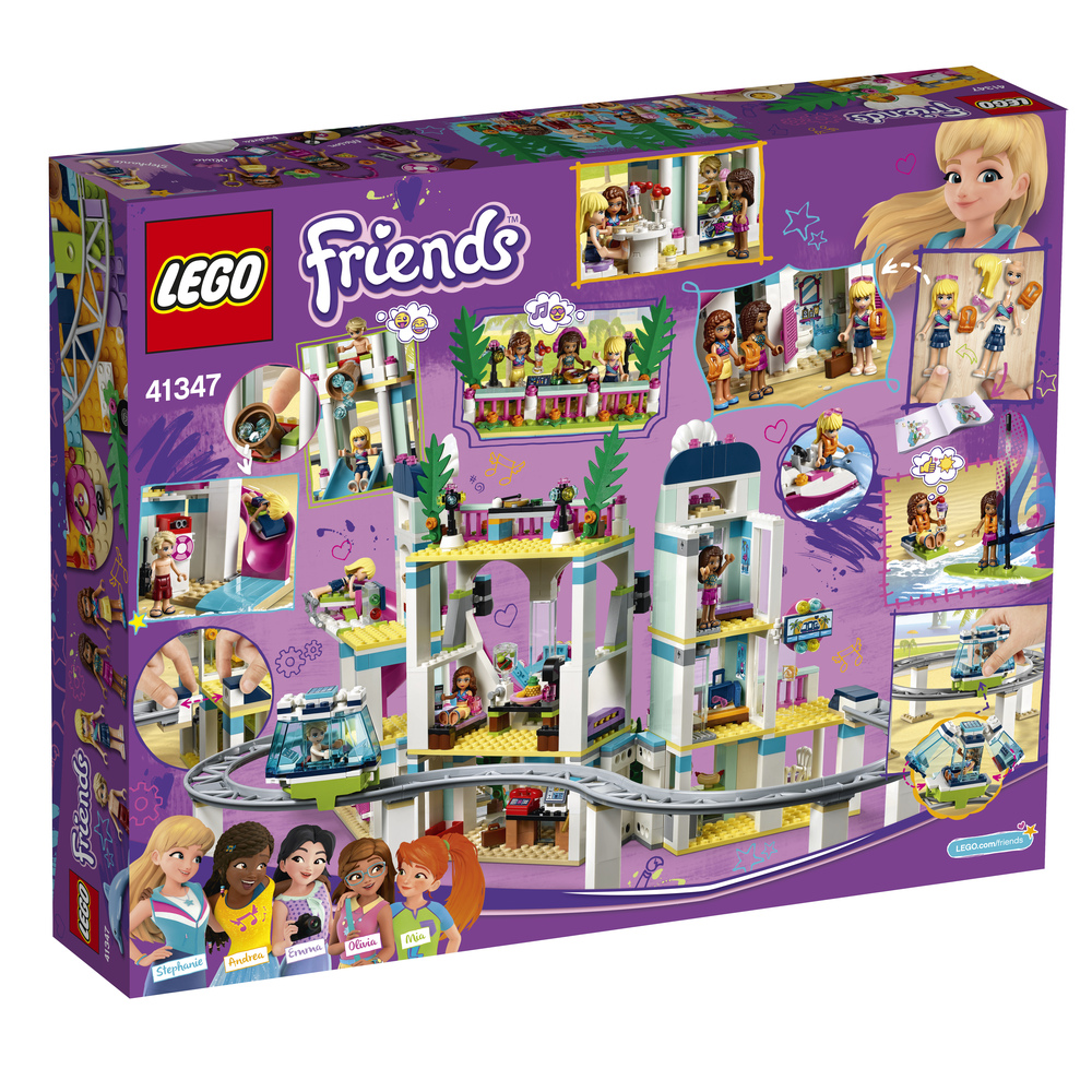Scatola Lego Friends che mostra un edificio a più livelli con figure e treno.