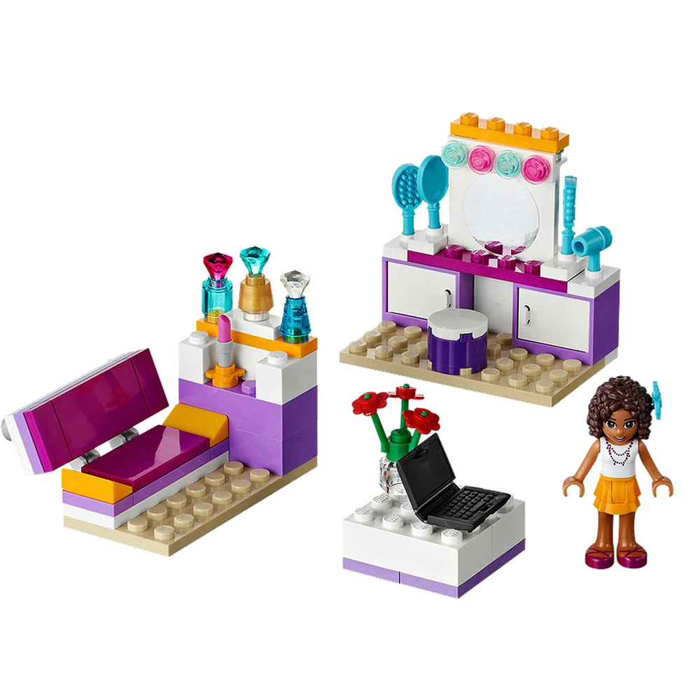 Un set Lego con toeletta, letto, laptop e personaggio.