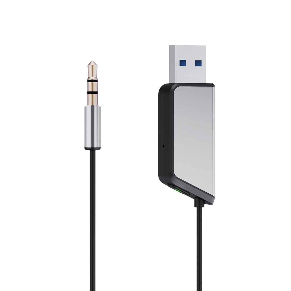 Adapter USB z gniazdem jack 3,5 mm na białym tle.