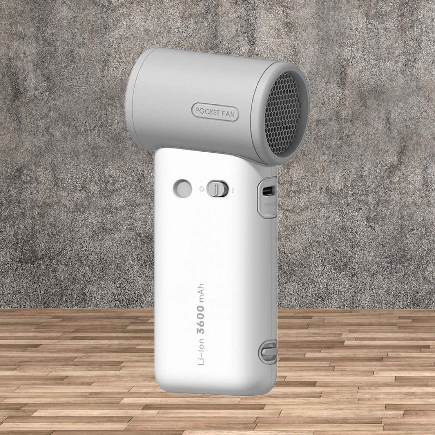 Ein weißer Handventilator mit Lüftungsgitter und „POCKET FAN“-Aufschrift.