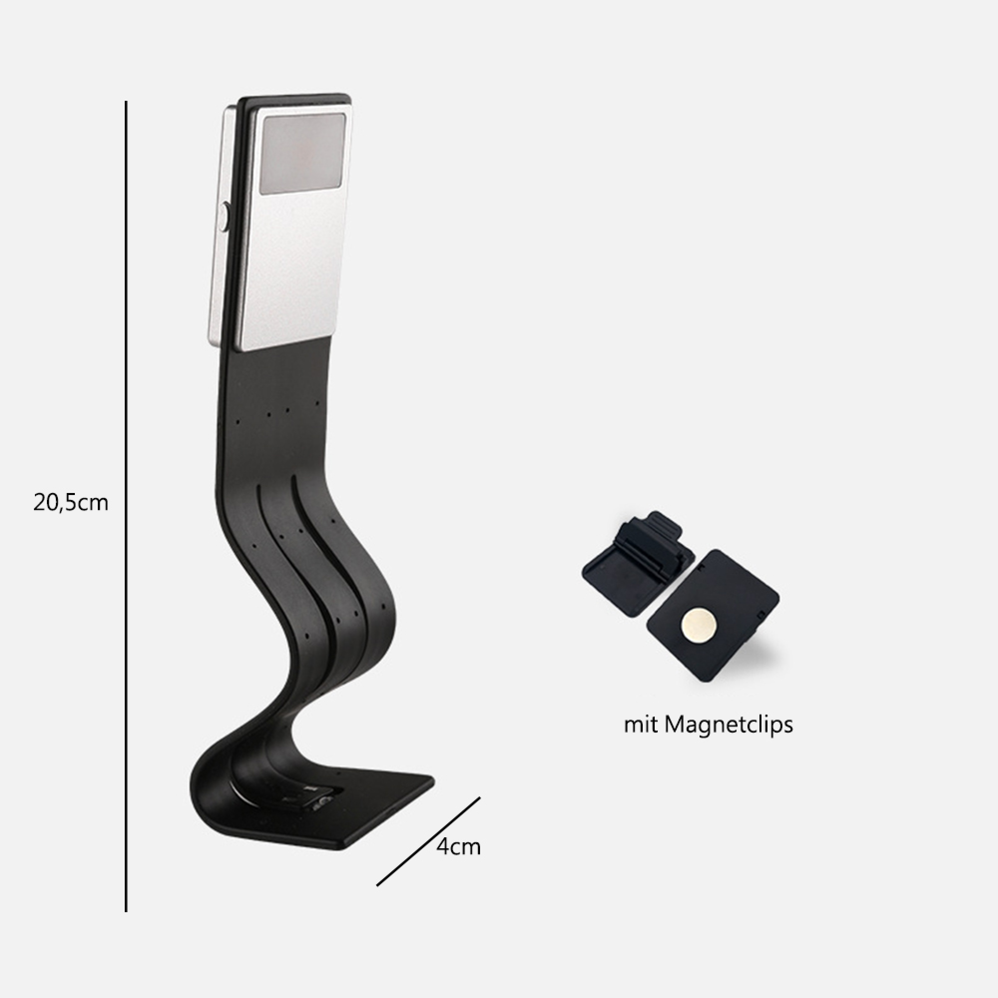 Ein schwarzes Leselicht mit silbernem Kopf und Magnetclips.