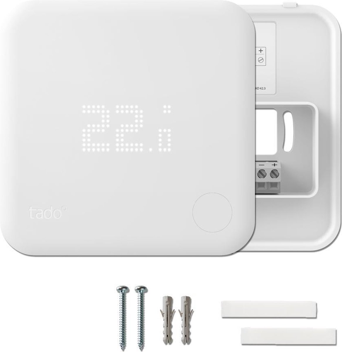 A white Tado thermostat display shows 22.0. Screws and wall plugs are beside it.