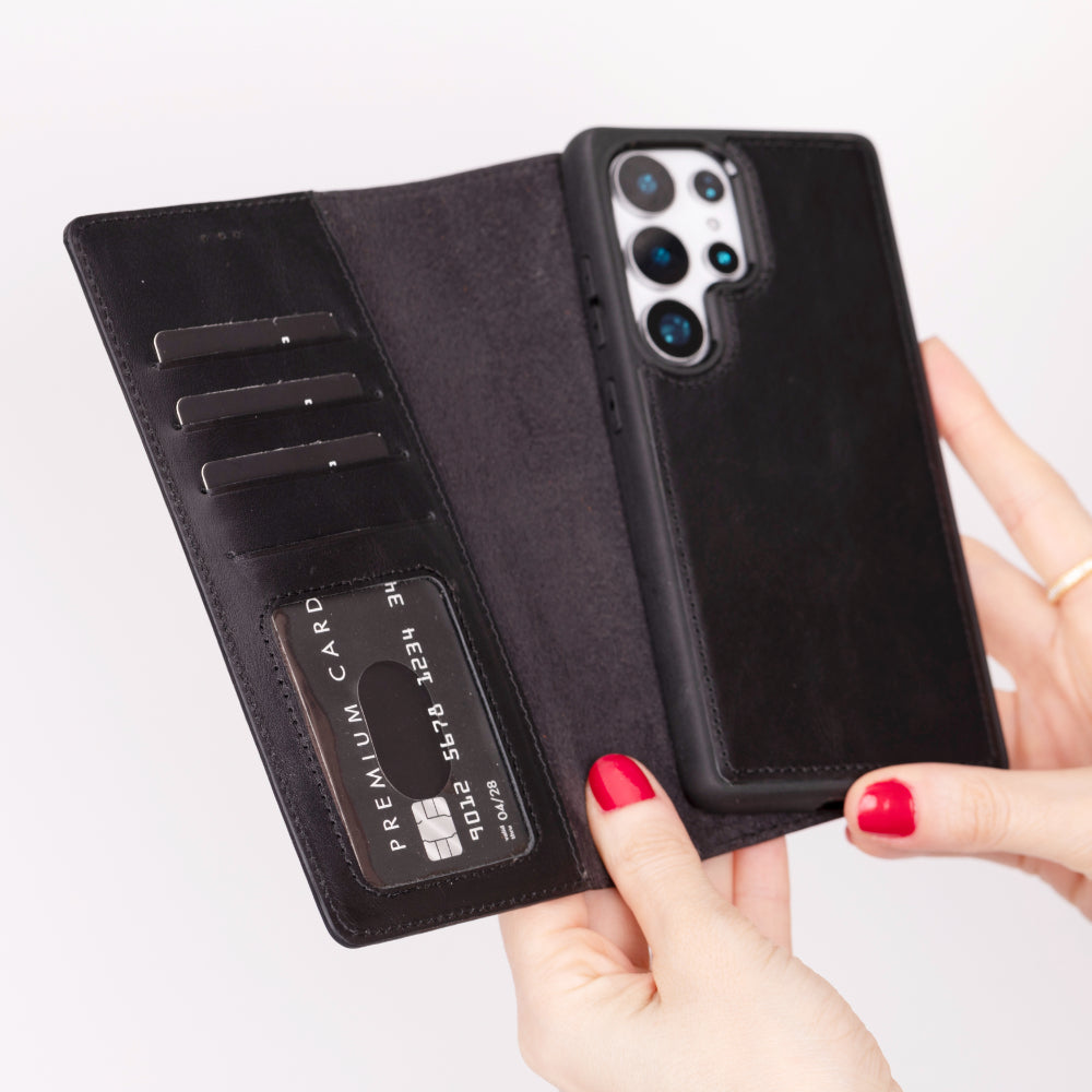 Kart yuvaları ve telefonlu siyah deri cüzdan telefon kılıfı.