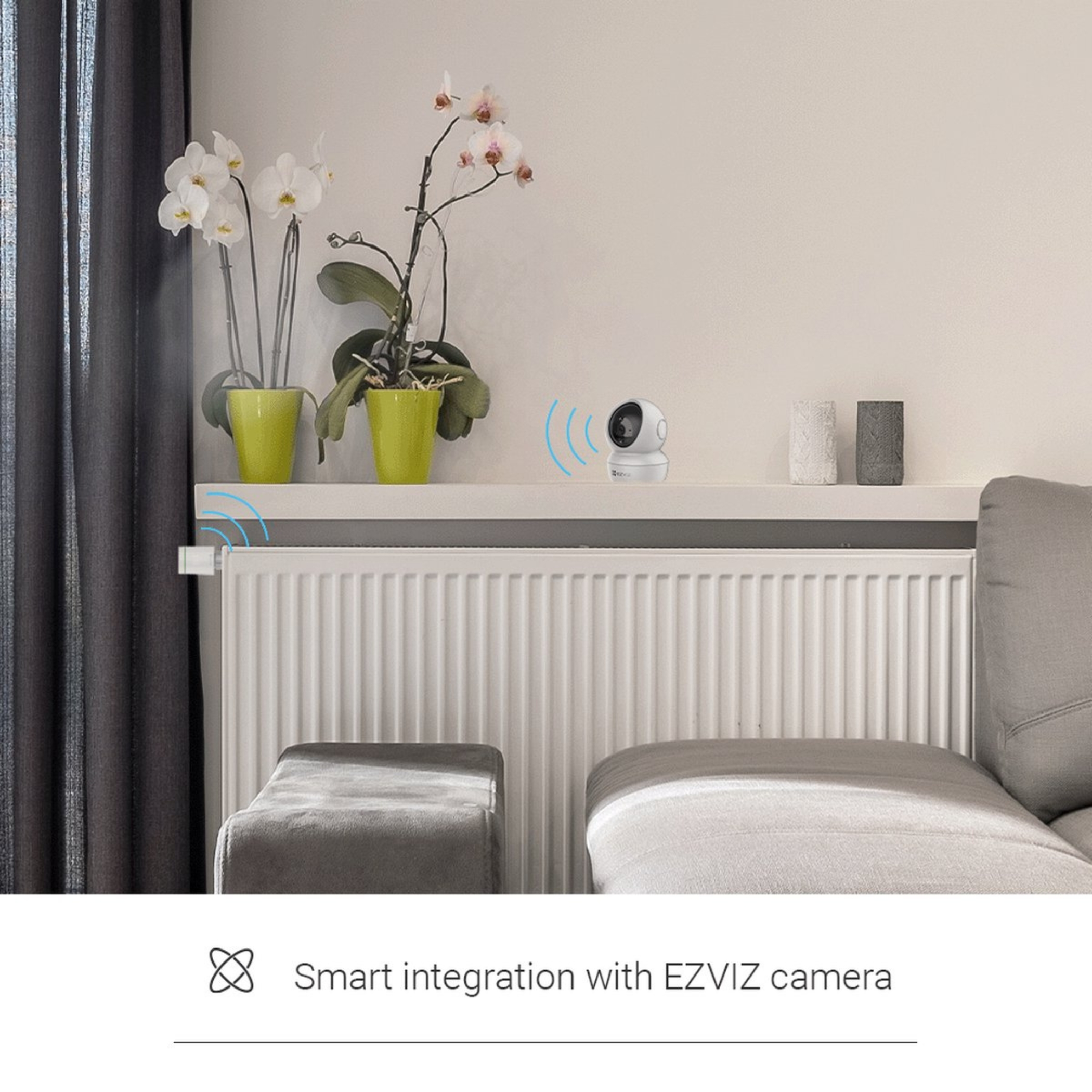 A white EZVIZ camera on a shelf above a radiator.