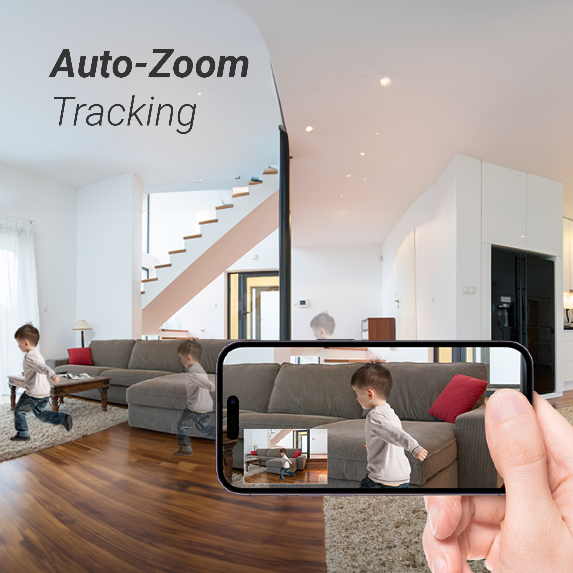 A boy runs in a living room; a hand holds a phone filming him.