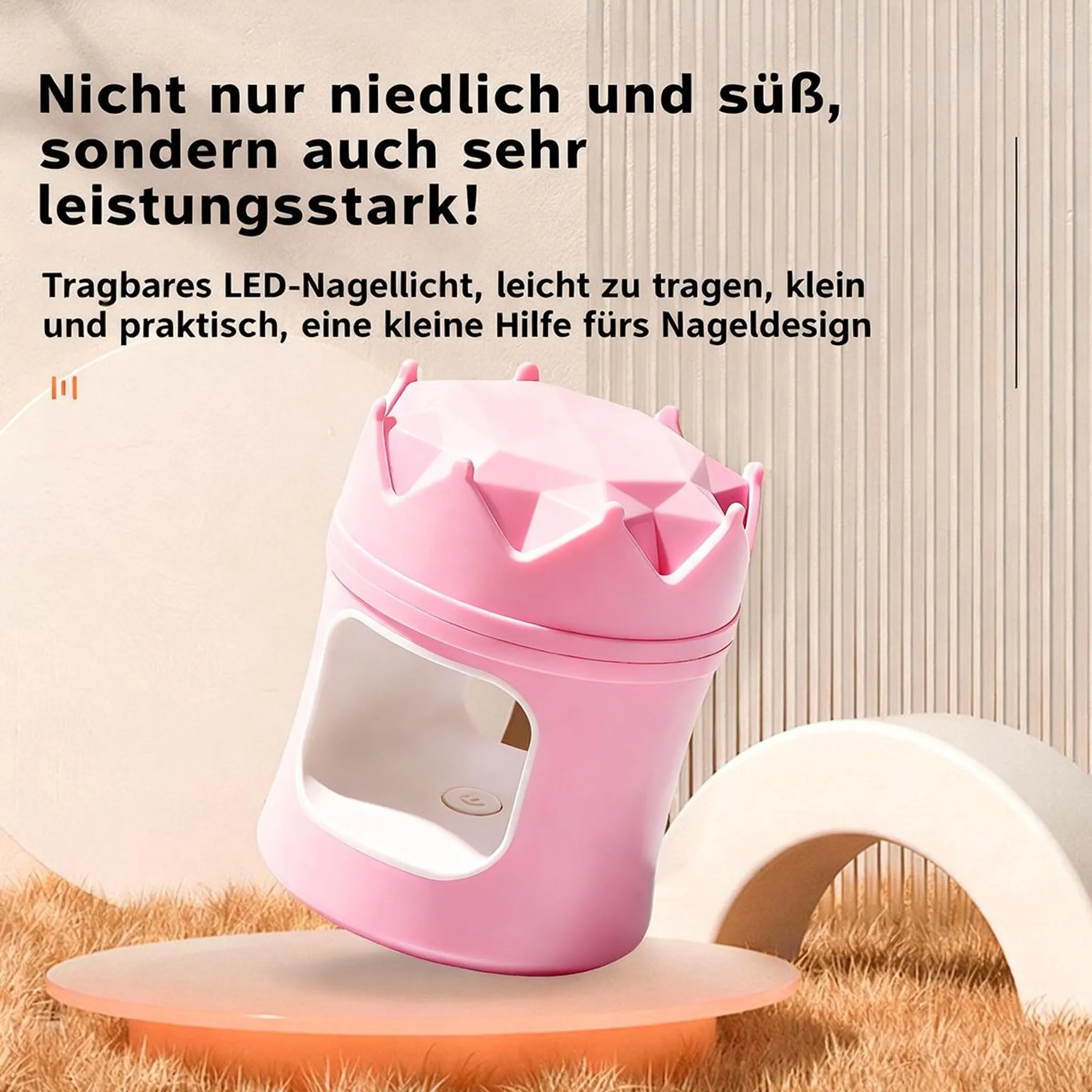 Ein rosafarbener, kronenförmiger Nageltrockner steht auf einem runden Podest mit Gras.