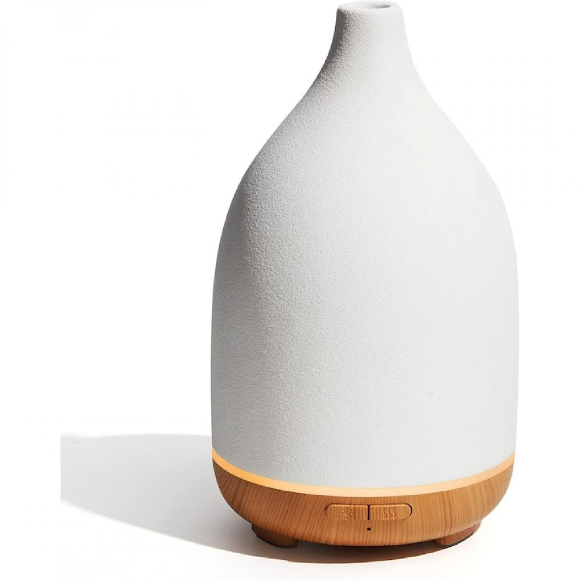 Ein weißer strukturierter Aroma-Diffusor mit Holzsockel und beleuchtetem Licht.