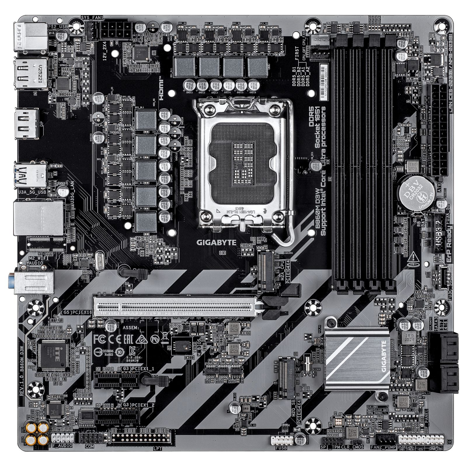 Black motherboard with gray stripes, CPU socket, RAM slots and various ports.