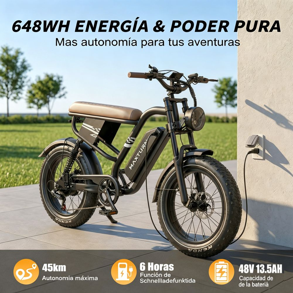 Bicicleta eléctrica negra con ruedas anchas en acera, cargando en pared.