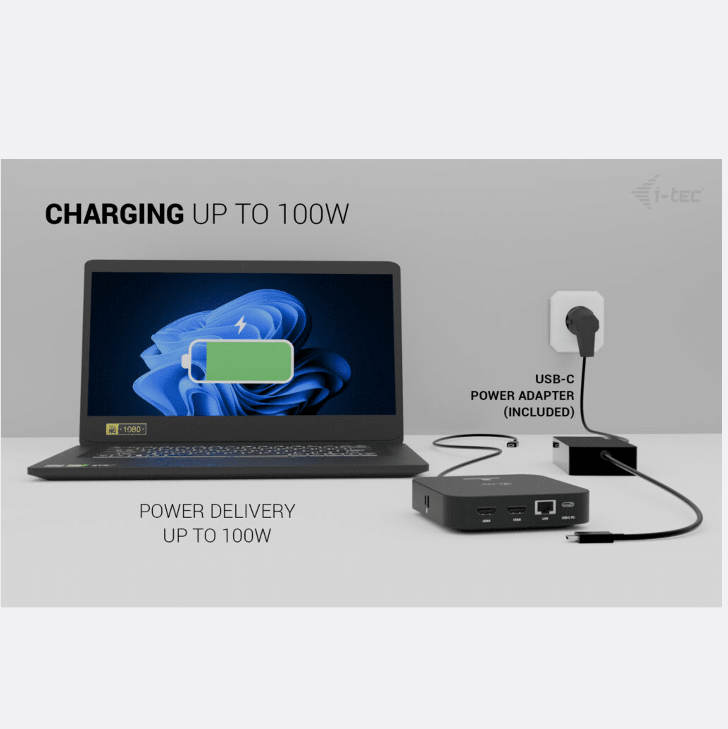 Laptop charging at 100W via USB-C. Power adapter and hub included.