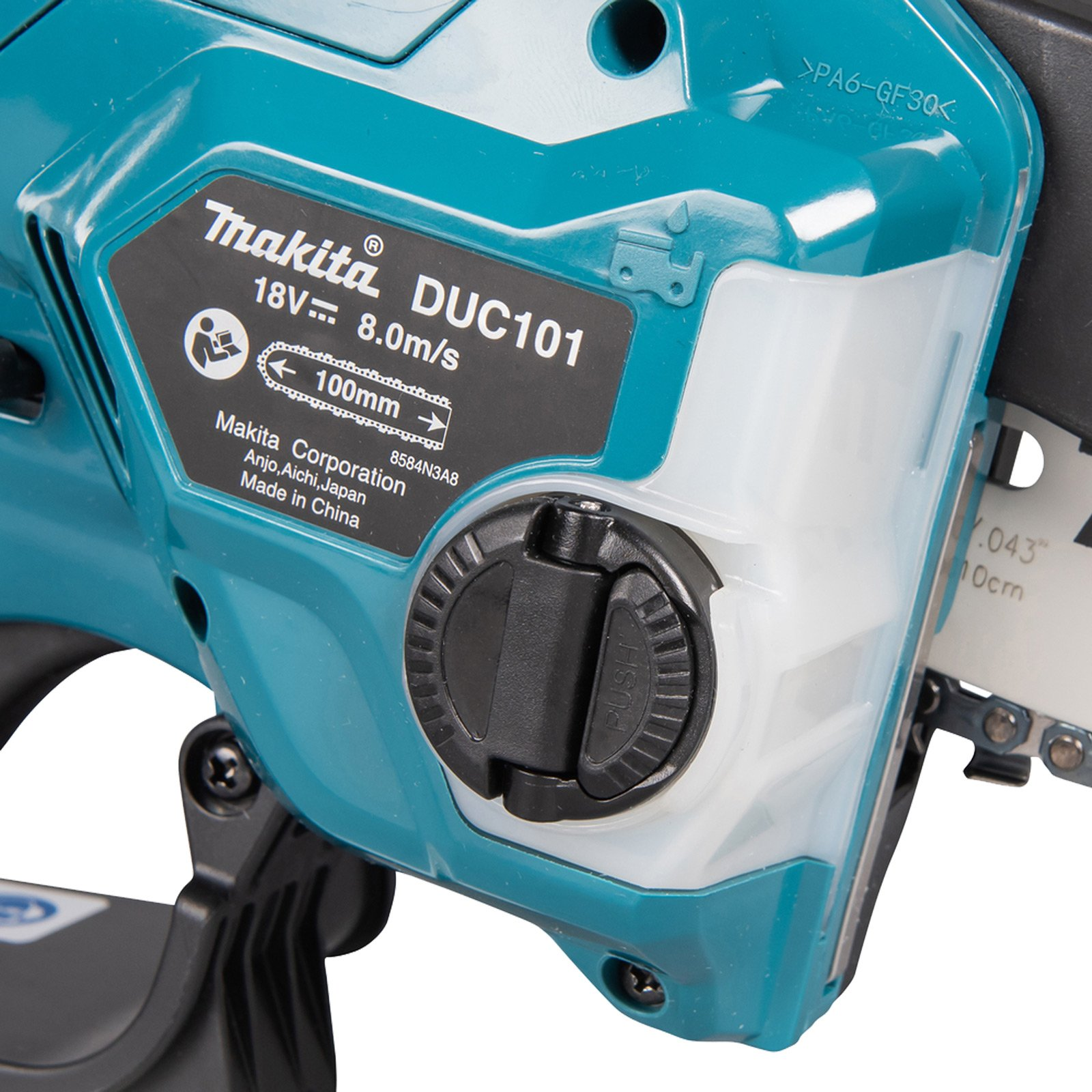 Nahaufnahme einer teal Makita DUC101 Kettensäge, mit schwarzer Kappe und 100mm Stange.