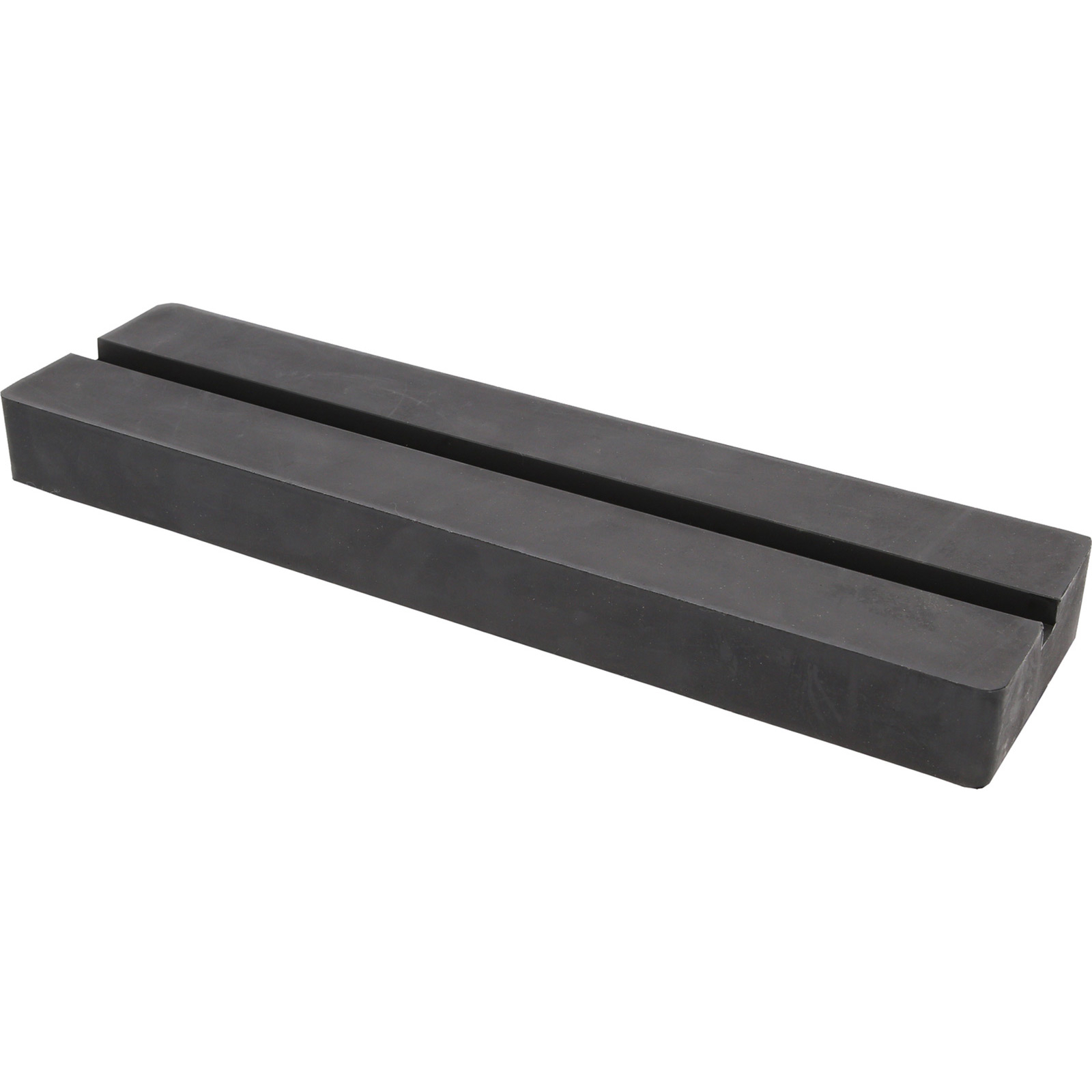 Ein schwarzer, rechteckiger Gummiblock mit einer Längsnut in der Mitte.