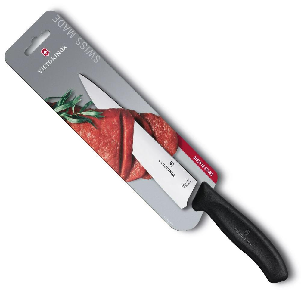 Siyah saplı Victorinox bıçağı, çiğ et ve biberiye ile paketlenmiş.
