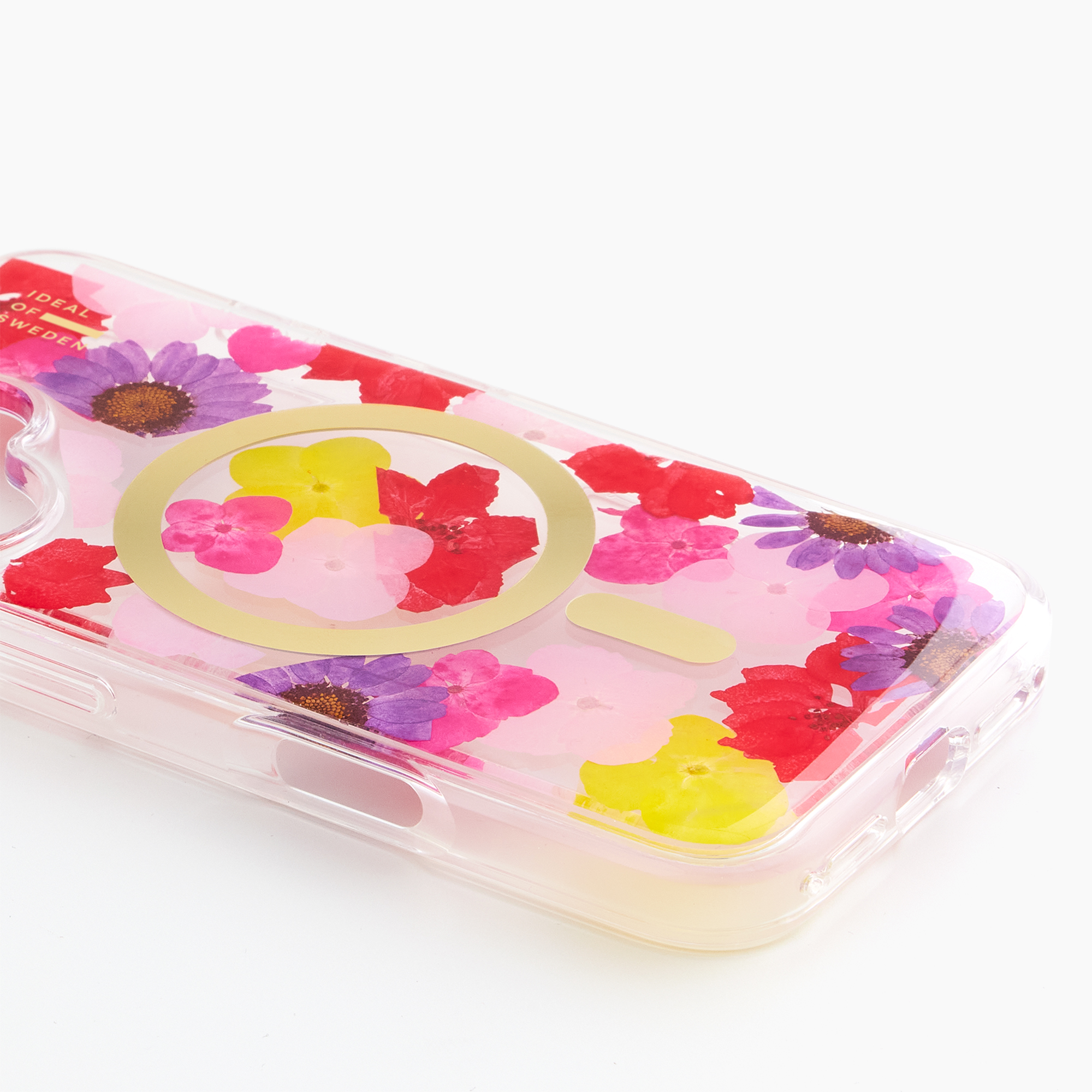 Transparente Handyhülle mit bunten Trockenblumen, darunter lila und rote Blüten.