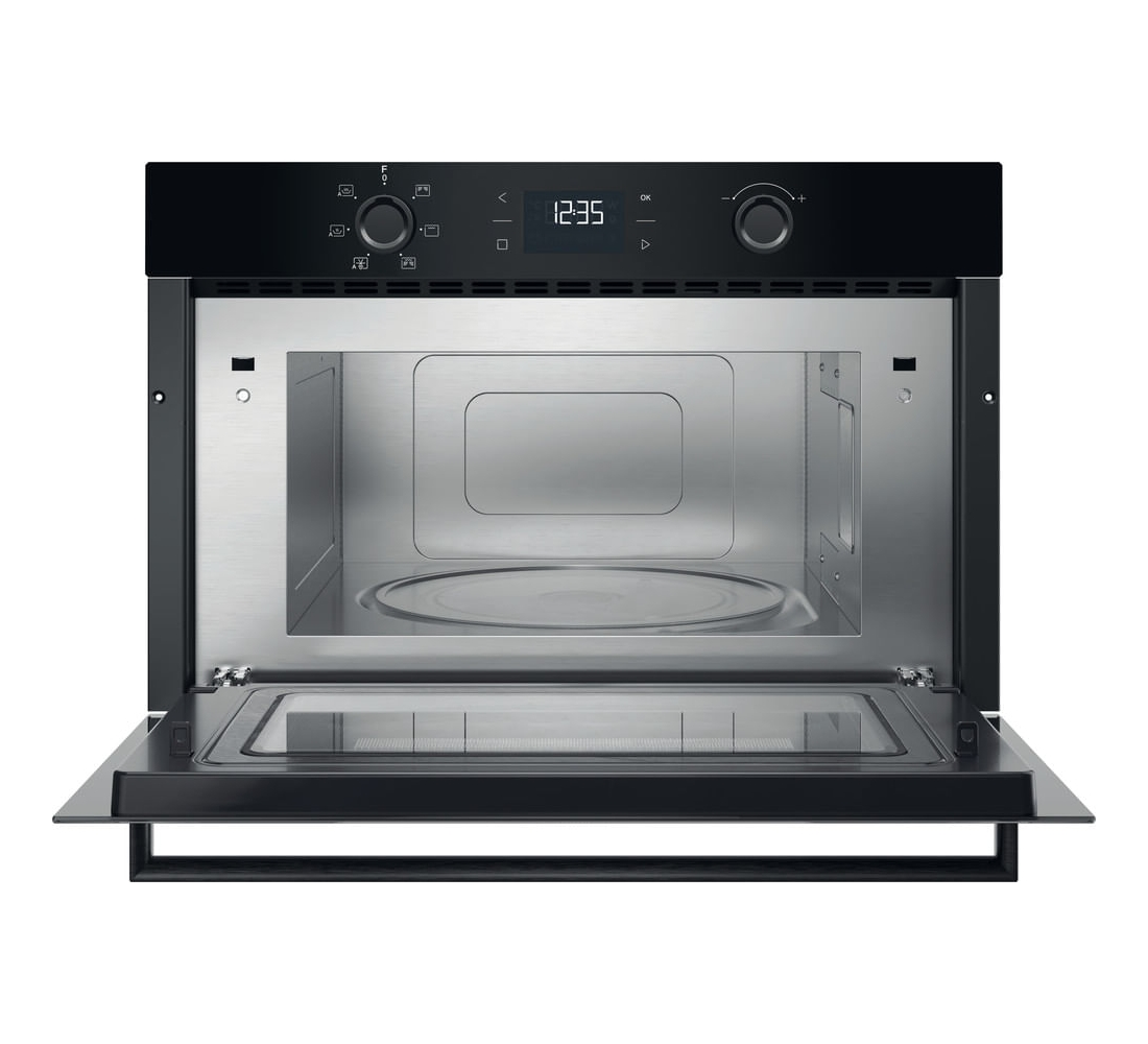 Forno a microonde da incasso nero aperto con display digitale e piatto girevole.