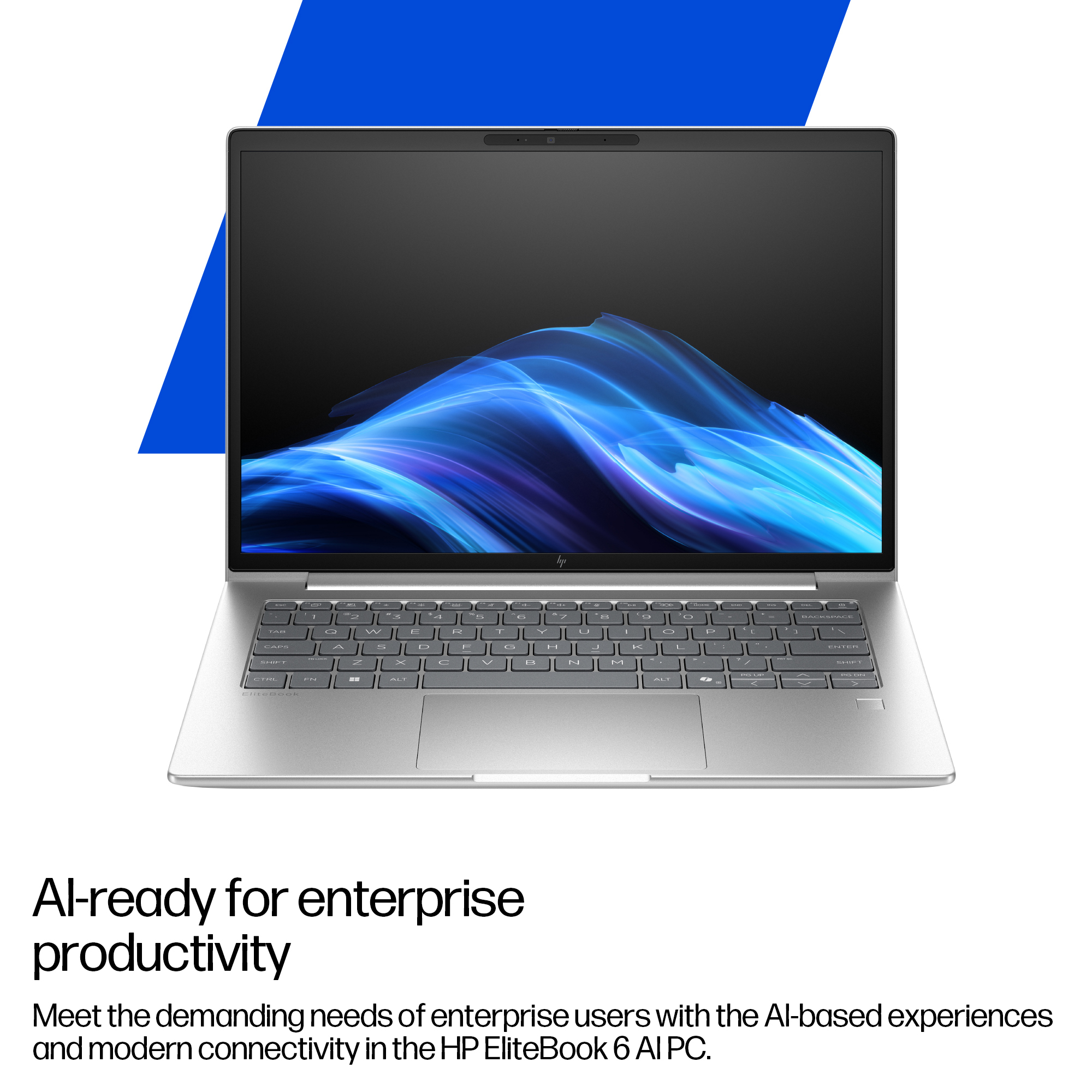 Un laptop argentato con sfondo blu e motivo digitale sullo schermo.