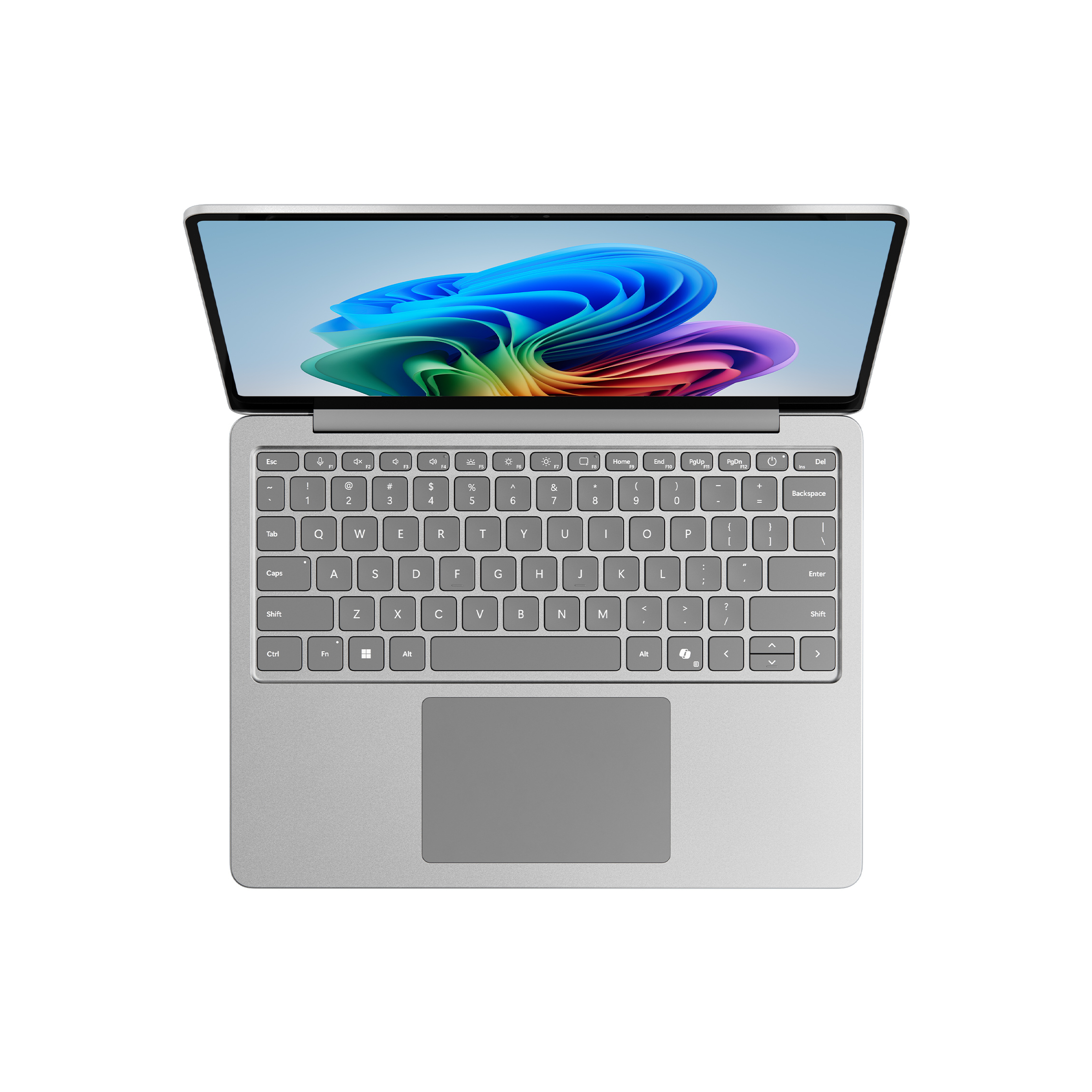 Ein silberner Laptop ist geöffnet. Die Tastatur und das Touchpad sind sichtbar.