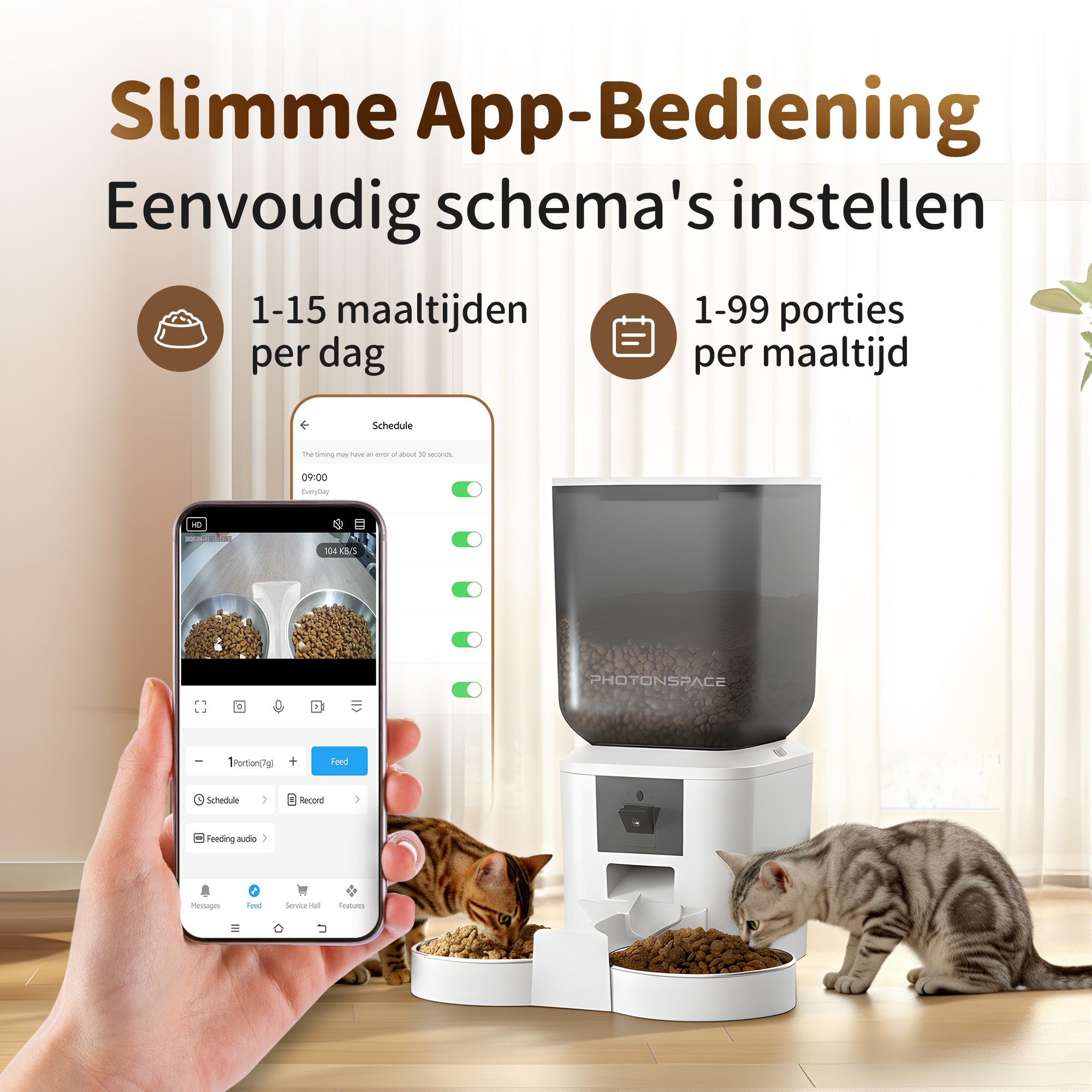 A cat feeder controlled by an app, with two cats eating. A hand holds a smartphone showing the app.