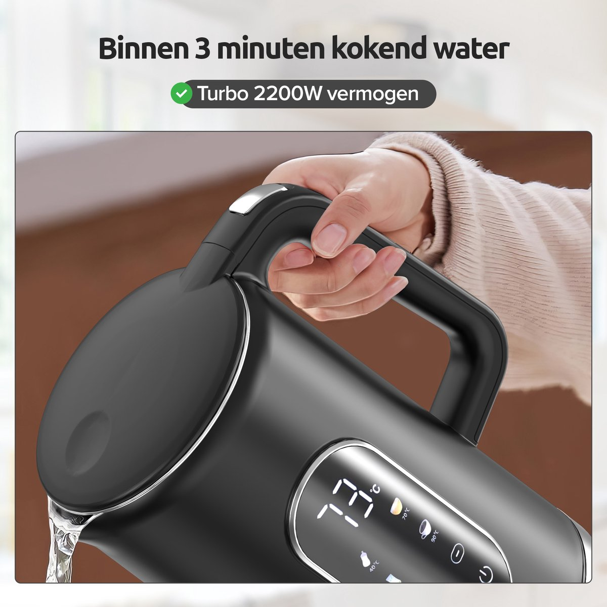 A hand holds a black kettle, with water pouring out. The display shows 73°C.