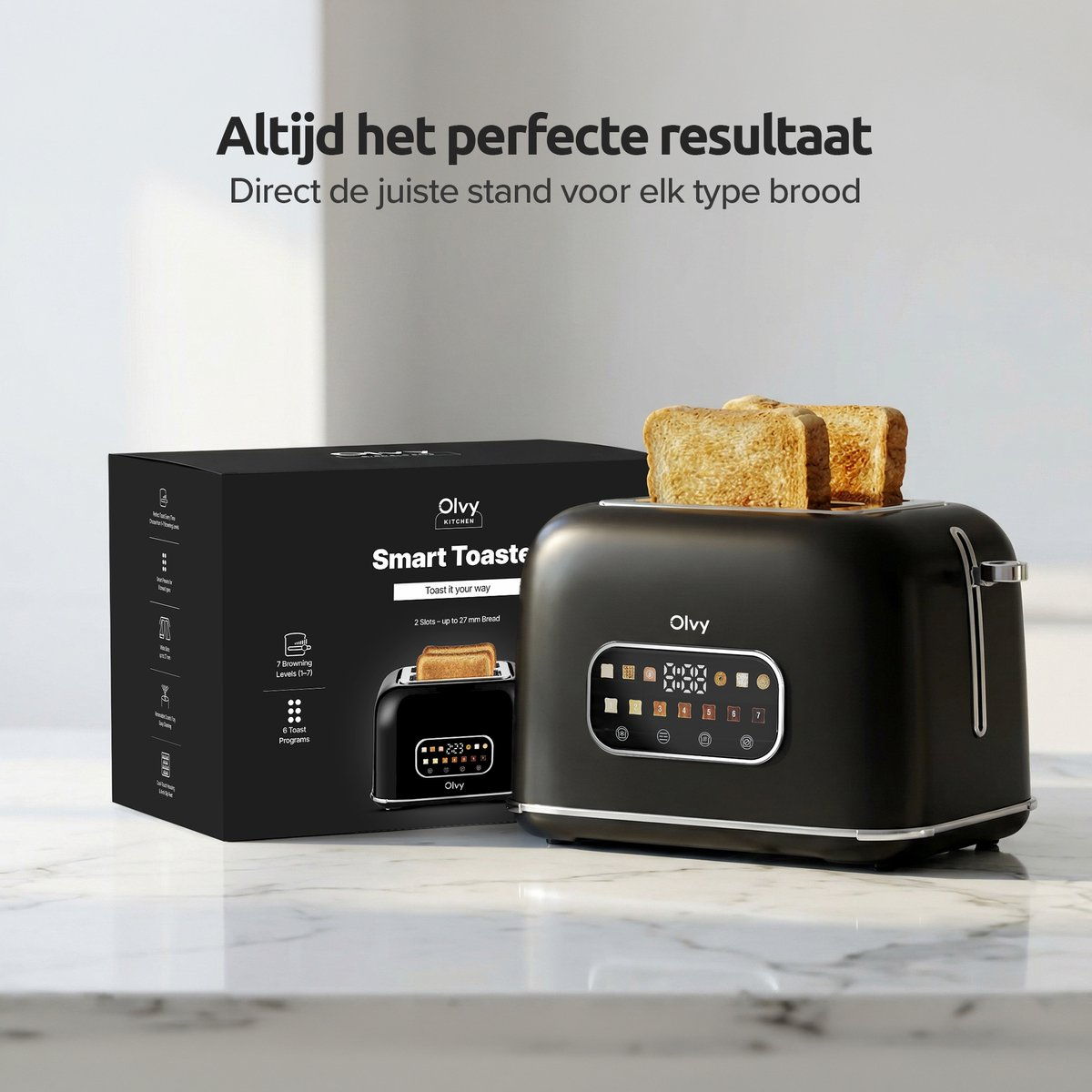 Un tostapane nero con due fette di toast e una scatola nera accanto.