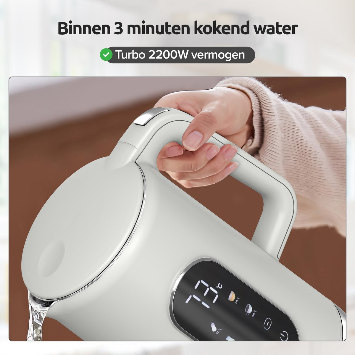 A hand holds a white electric kettle pouring water. The display shows 73°C.