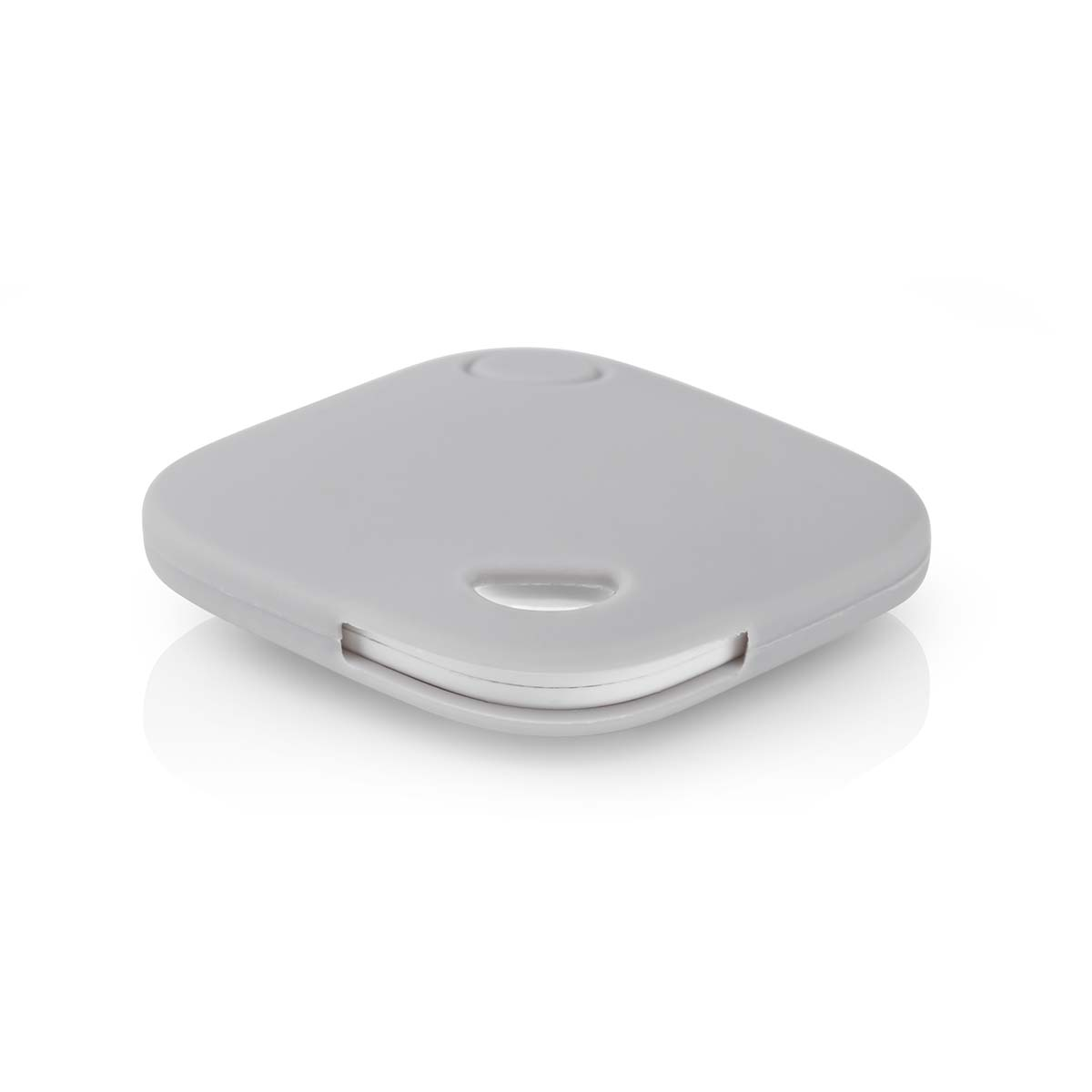 A light gray, square-shaped object with rounded corners sits on a white surface.