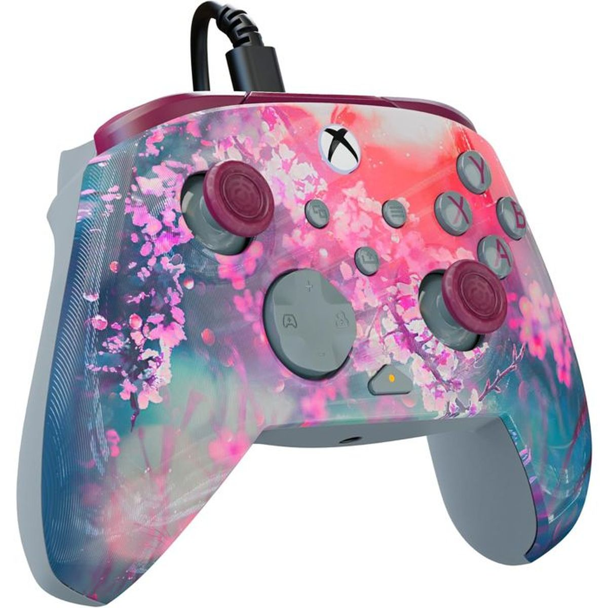 Eine pink-blaue Xbox-Steuerung mit Kirschblütendesign und grauen Knöpfen.