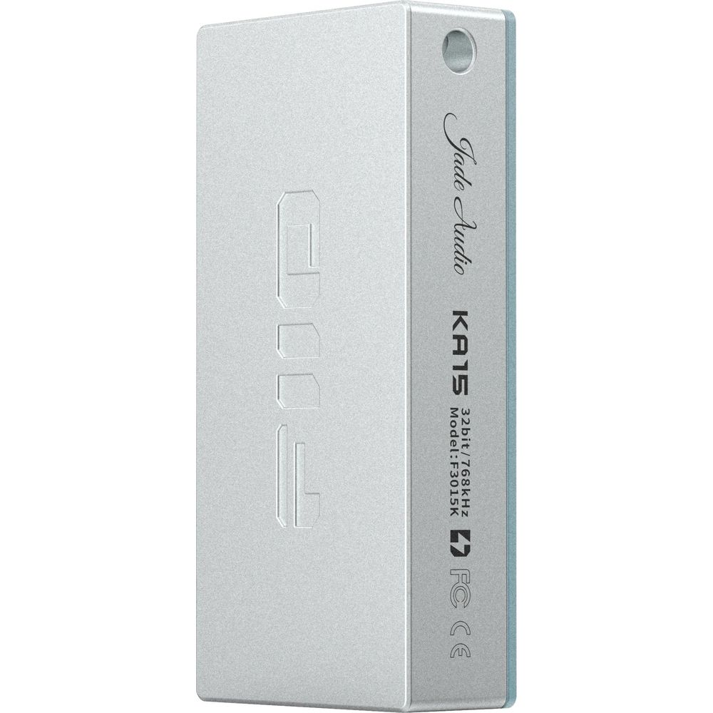 DAC de audio plateado con número de modelo F3015K y marcas FCC/CE.