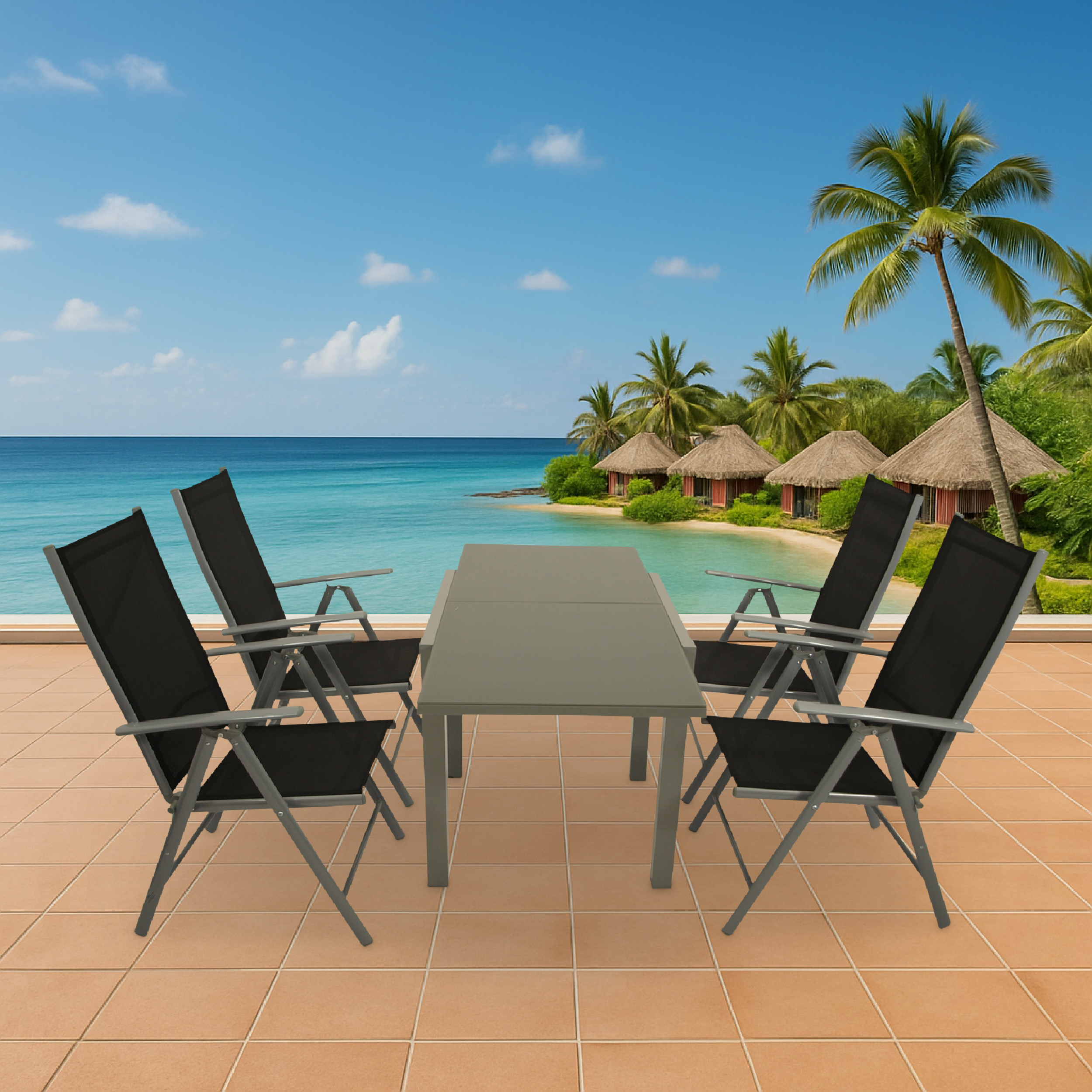 Ein Tisch und vier Stühle auf einer Terrasse mit Blick auf das Meer und Bungalows.