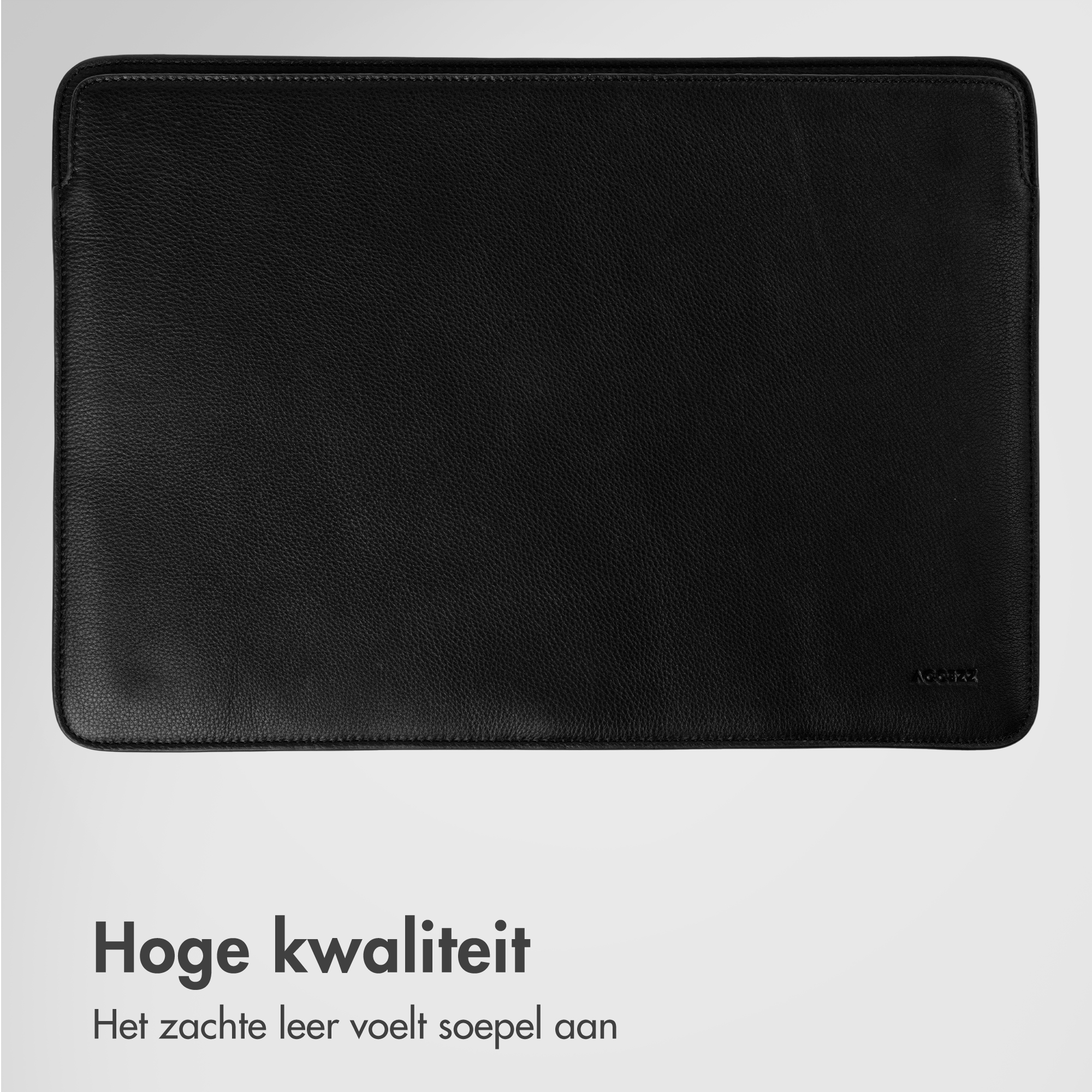 Black leather sleeve for a notebook, with a subtle logo on the bottom right.