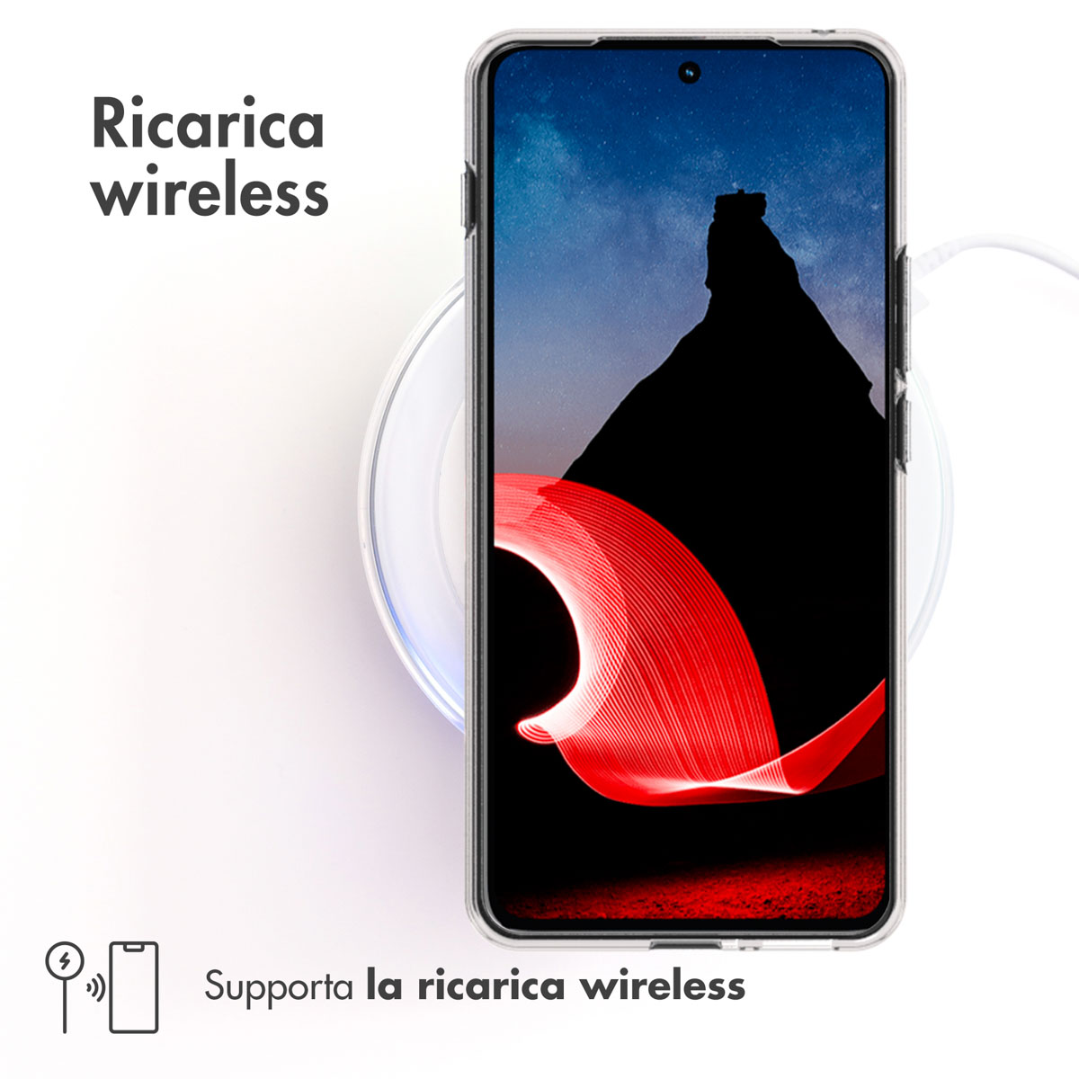 Smartphone su caricatore wireless con sfondo montagna e arte luminosa.