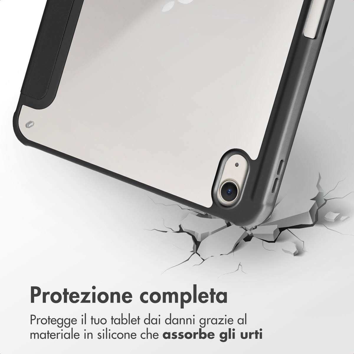 A tablet in a black case falls, surrounded by cracked stones.