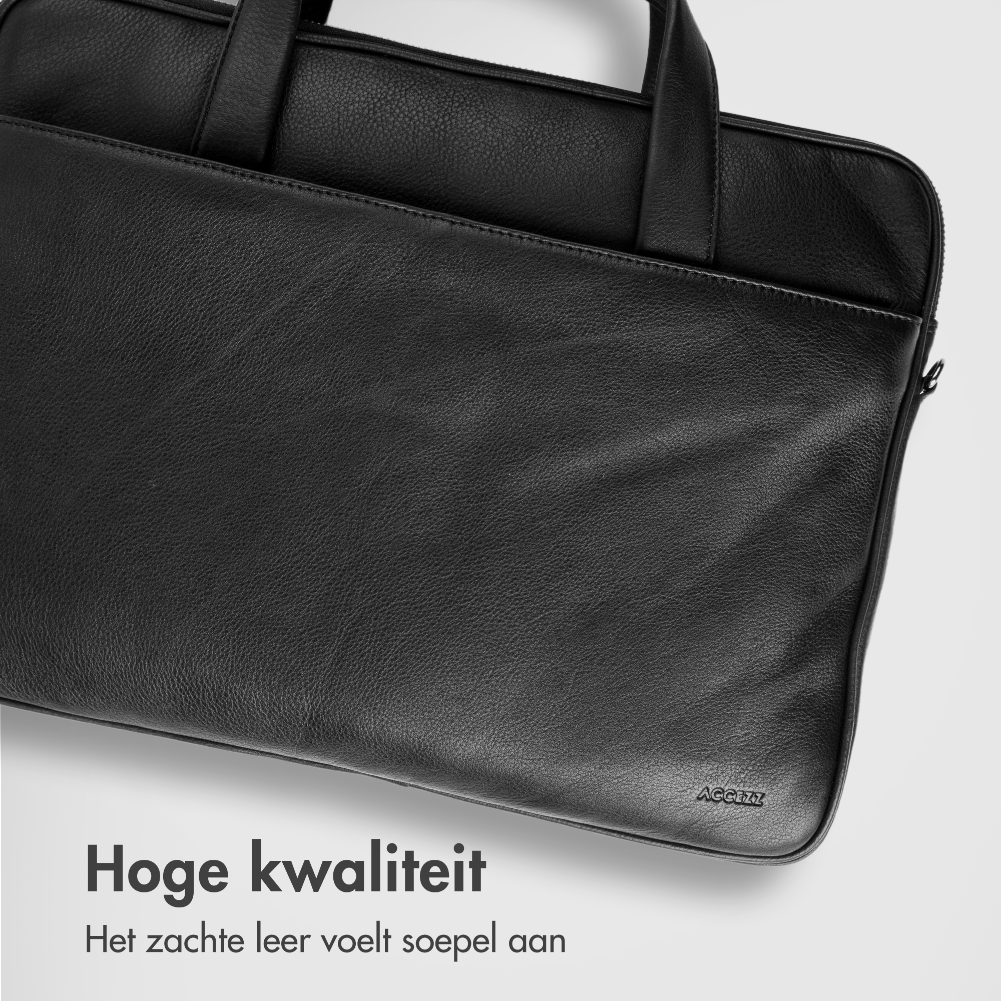 Black leather bag with handles and zipper. ACCZZ brand.
