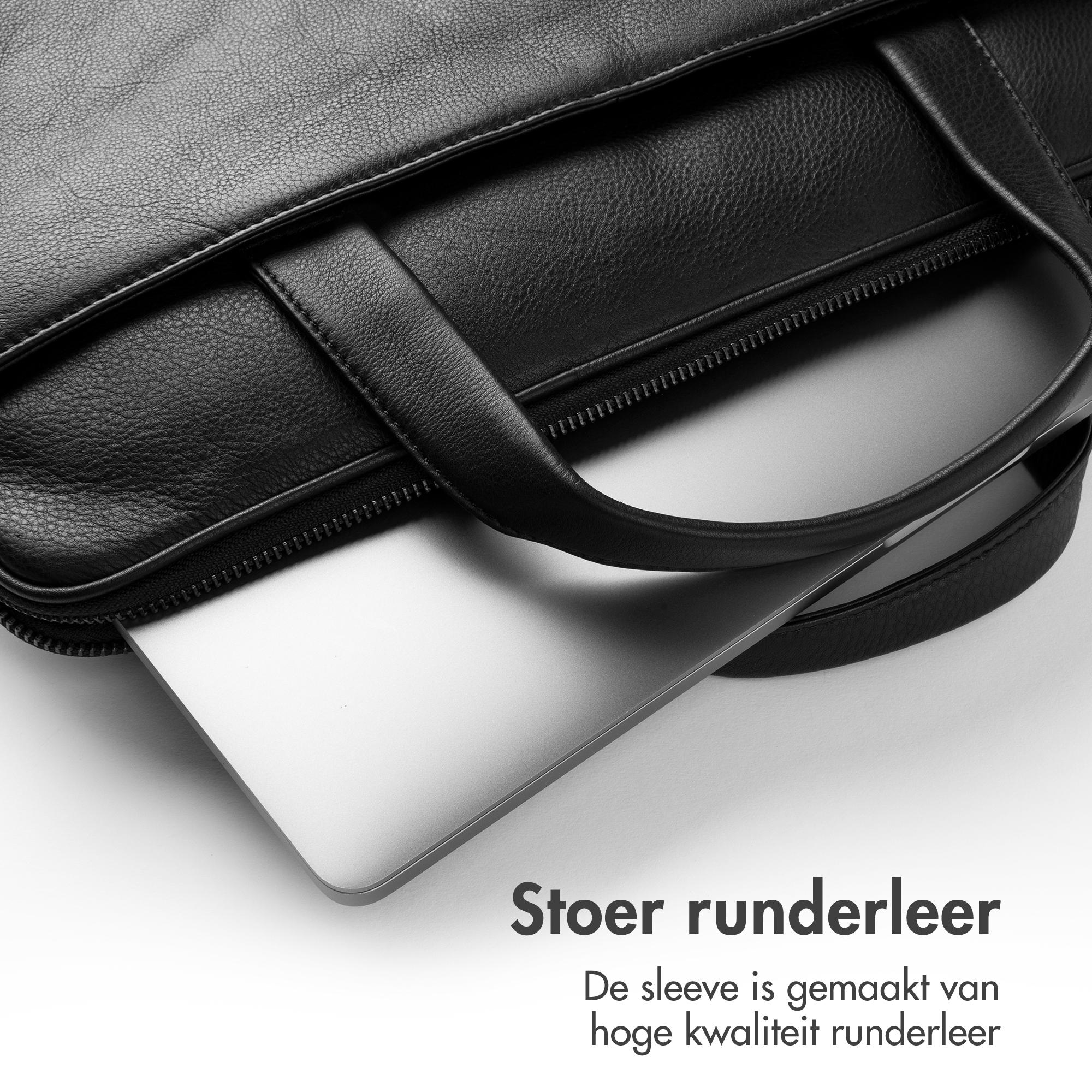A black leather bag with a laptop partially sticking out.