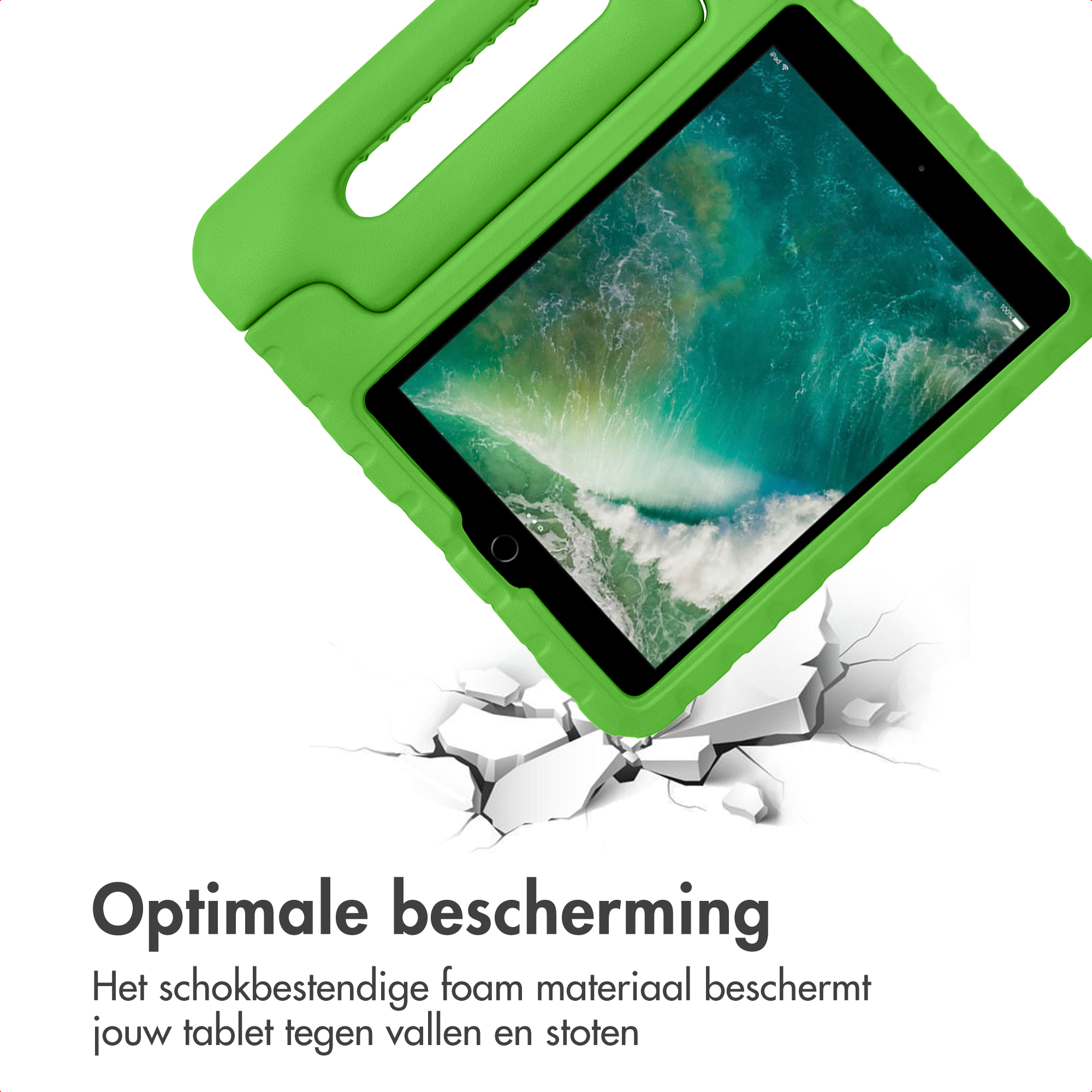 Groene tablethoes met handvat op gebarsten ondergrond.