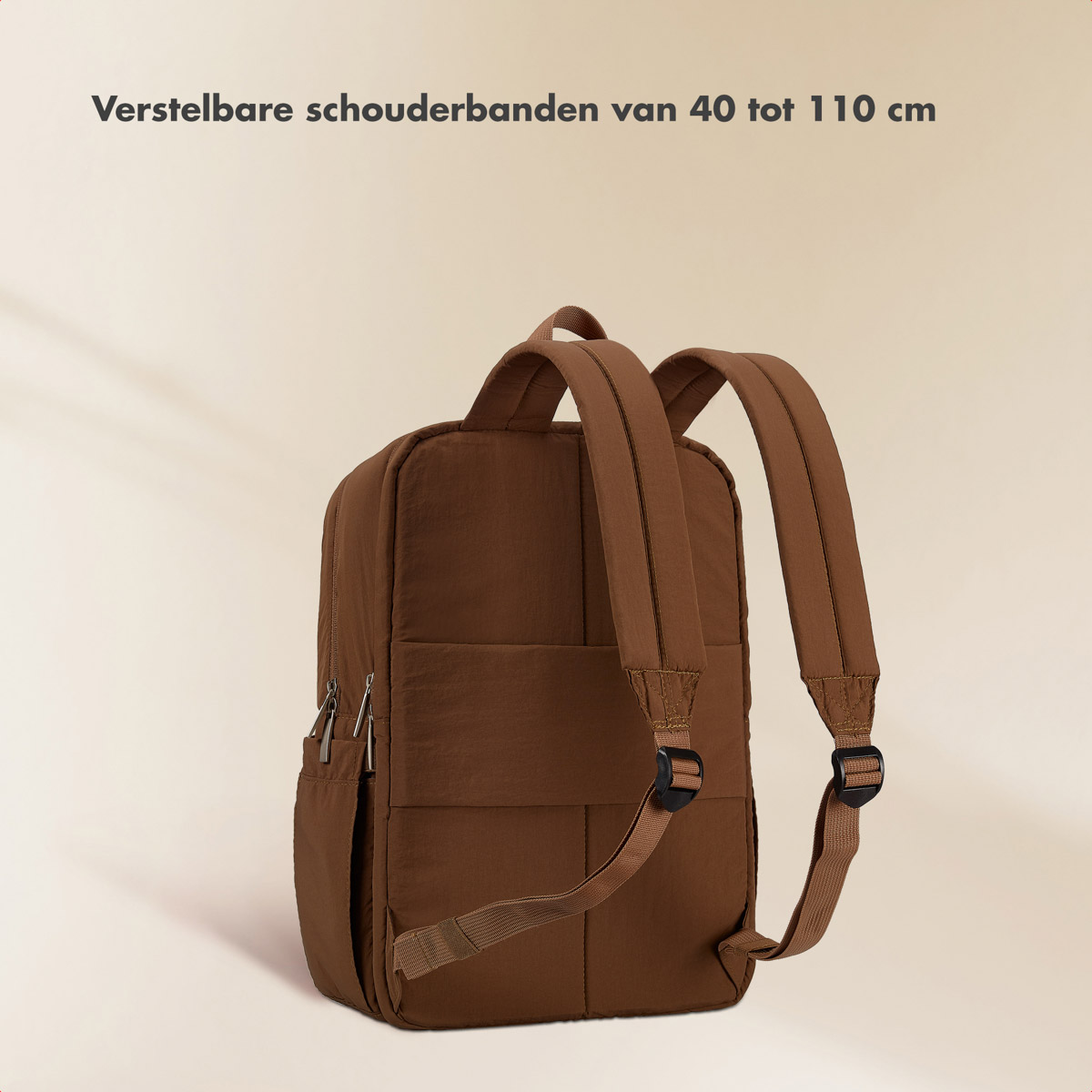 Brown backpack with adjustable straps and zippers.
