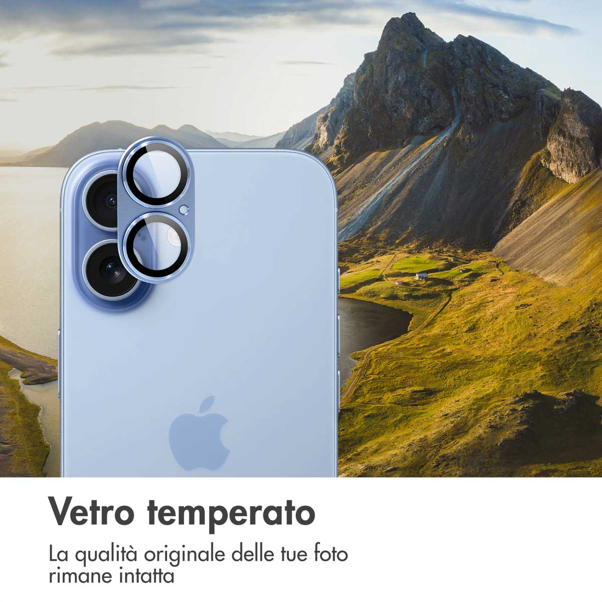 A close-up of a light blue iPhone with camera lenses against a mountain landscape.