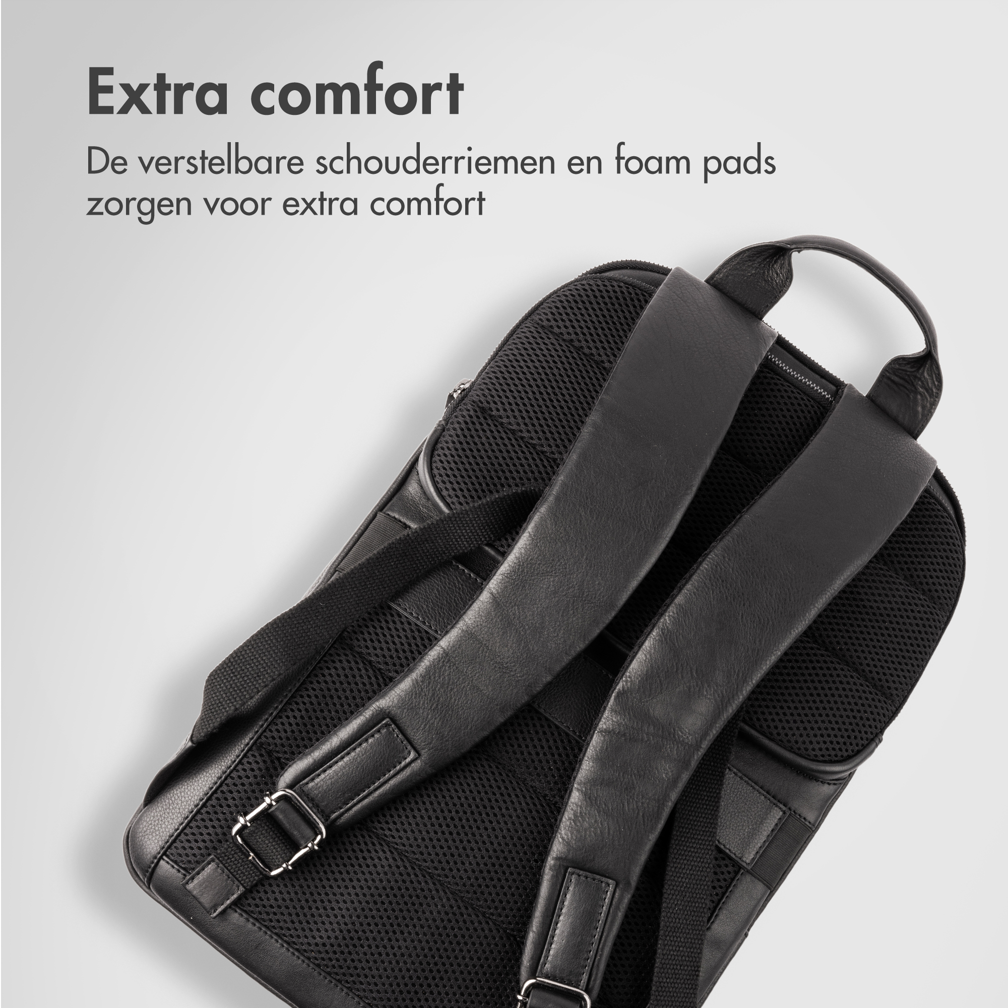 Black leather and mesh backpack with adjustable shoulder straps.
