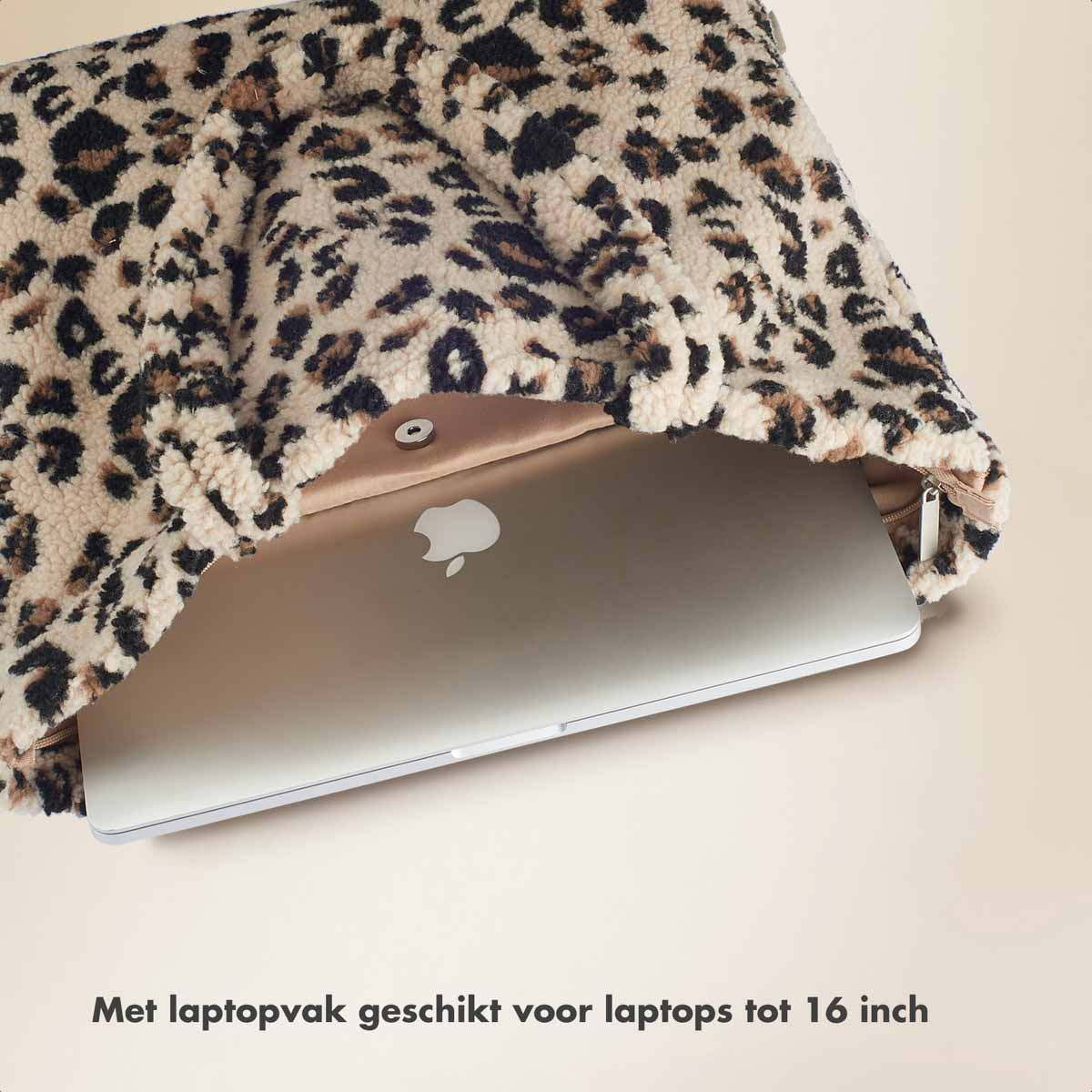 A leopard print laptop sleeve with a silver laptop inside.