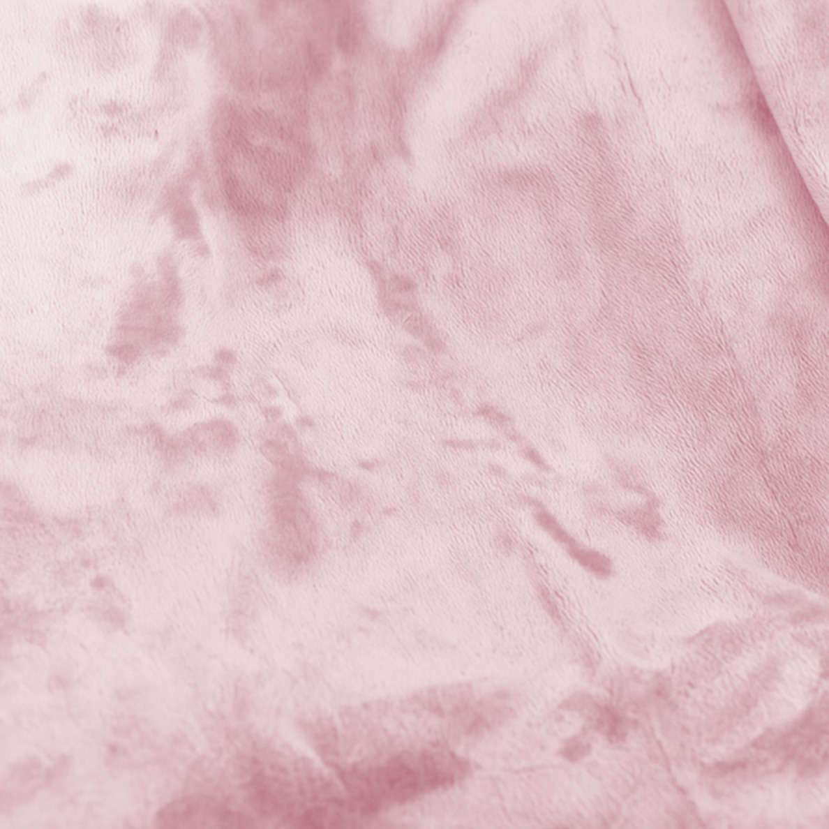 Pink fabric with irregular darker spots, close-up.