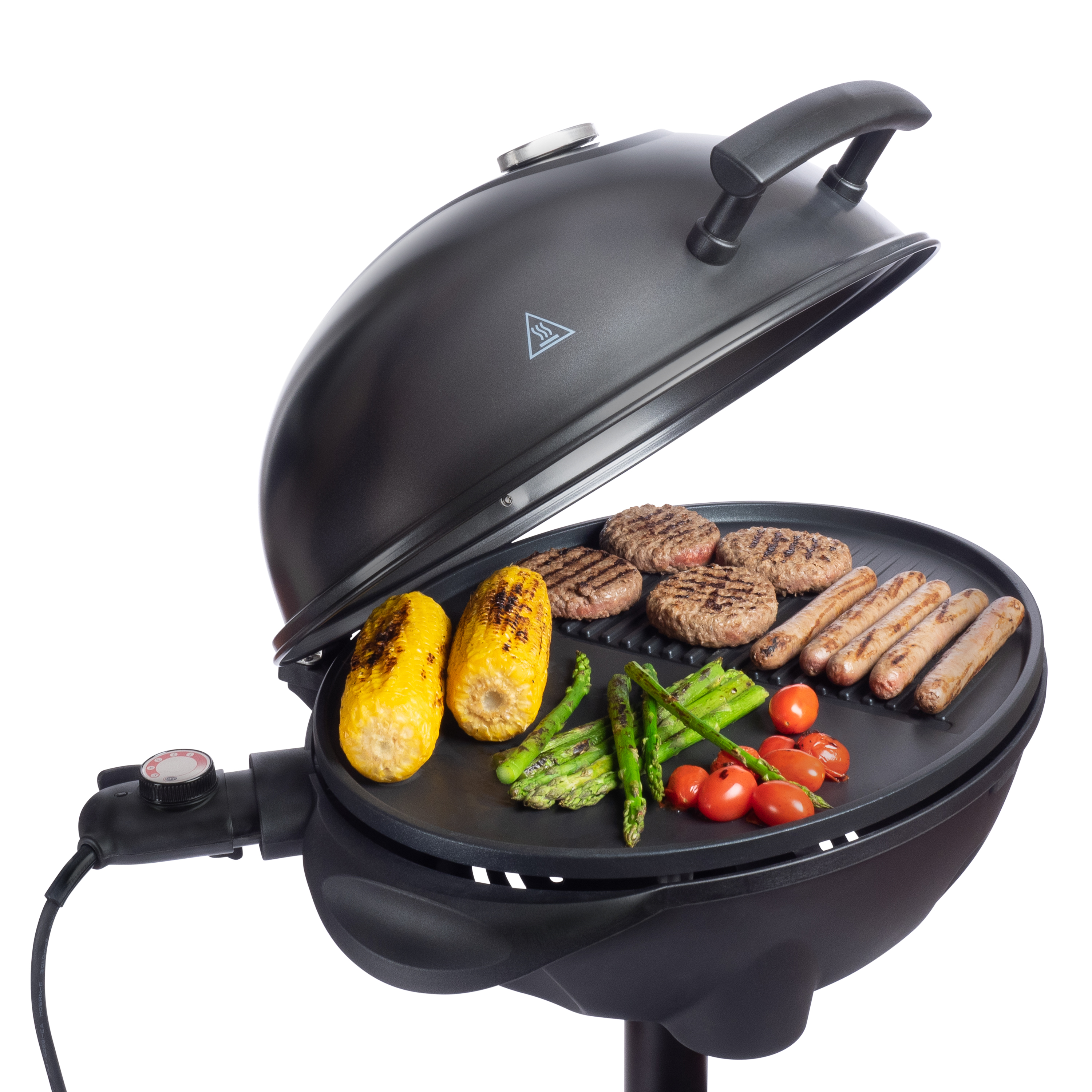 An open black grill with burgers, sausages, corn on the cob, asparagus, and tomatoes.