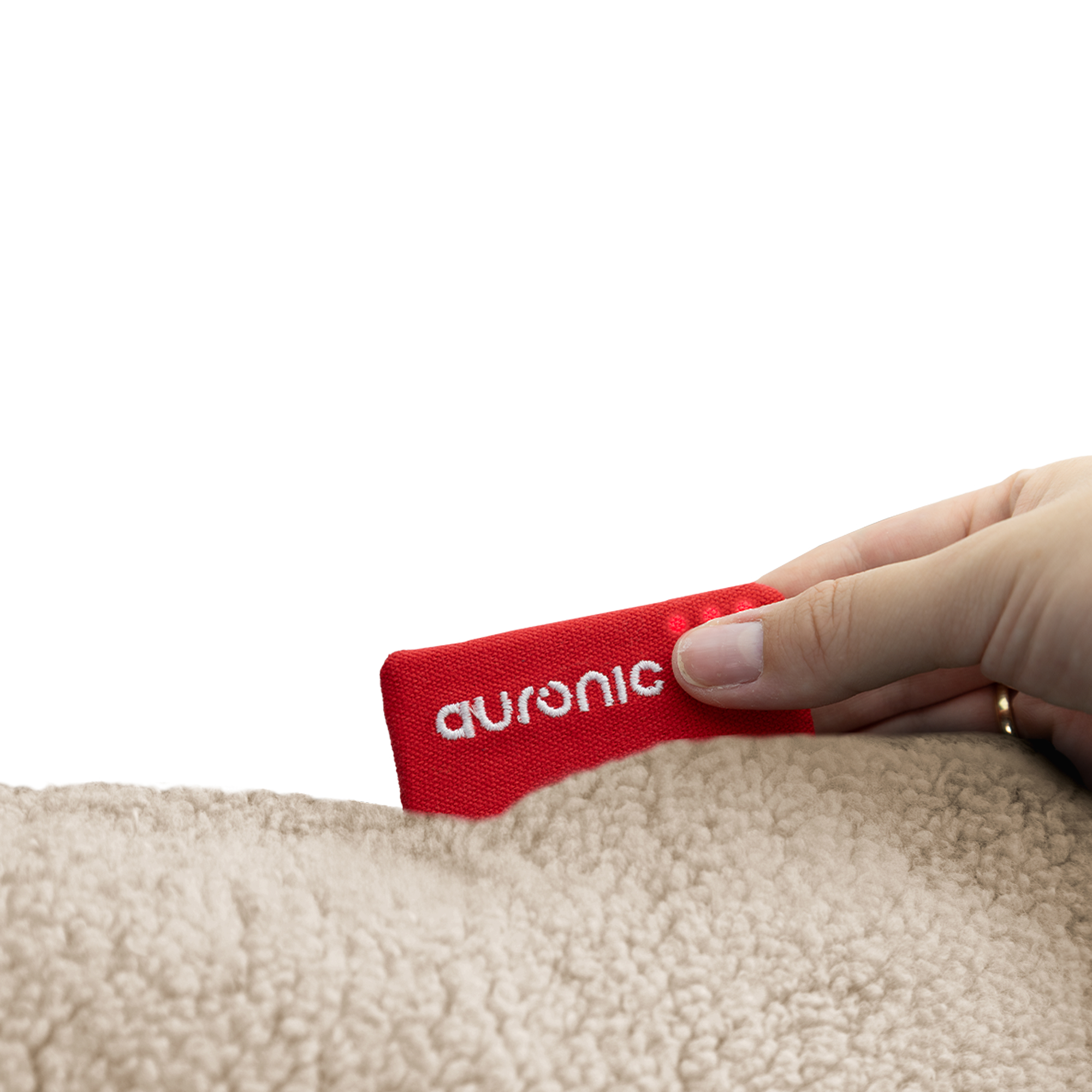 A hand holds a red tag with the Auronic logo above beige teddy bear fur.